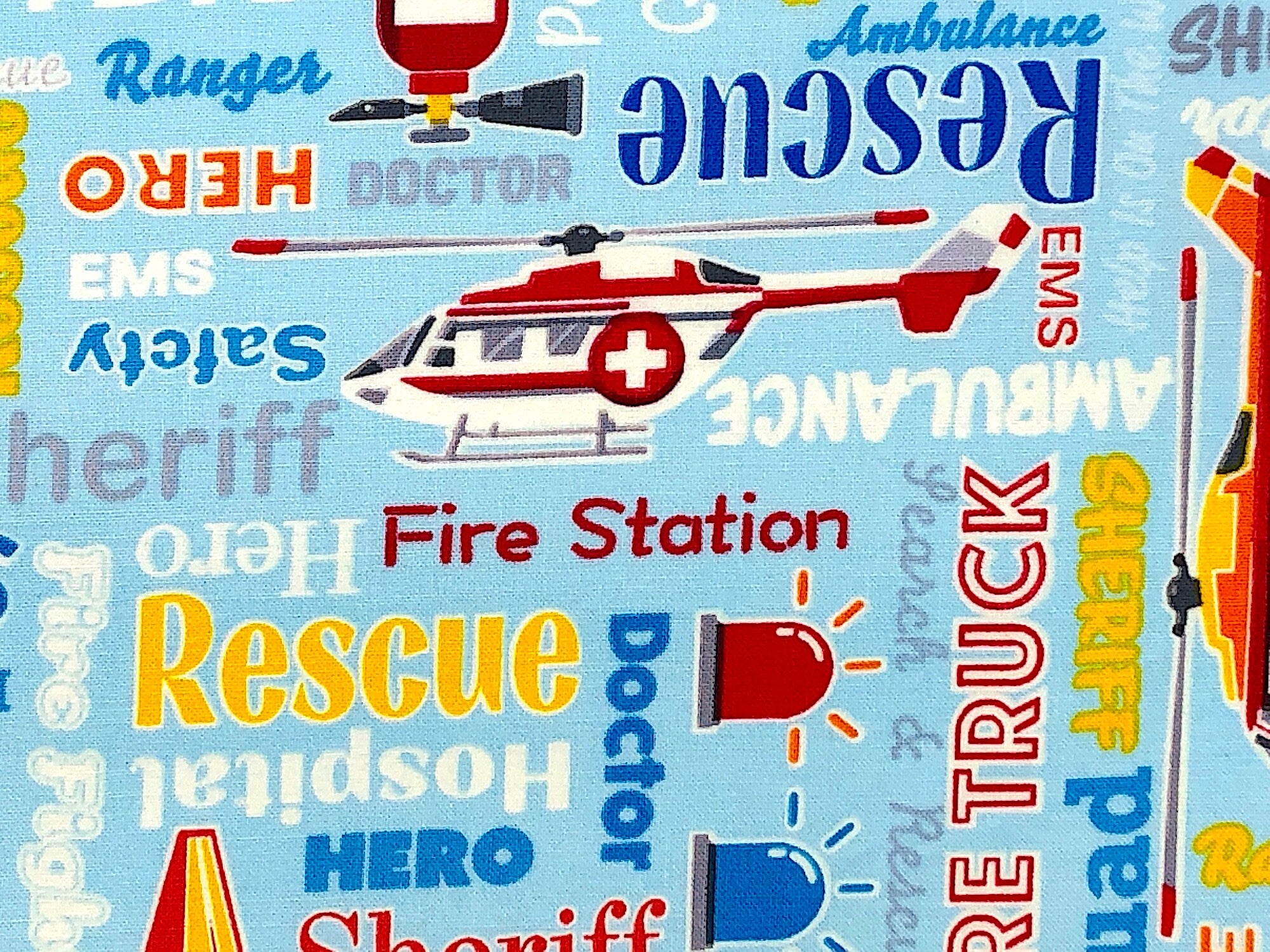 Close up of a helicopter and words such as rescue, fire station, hospital and more.