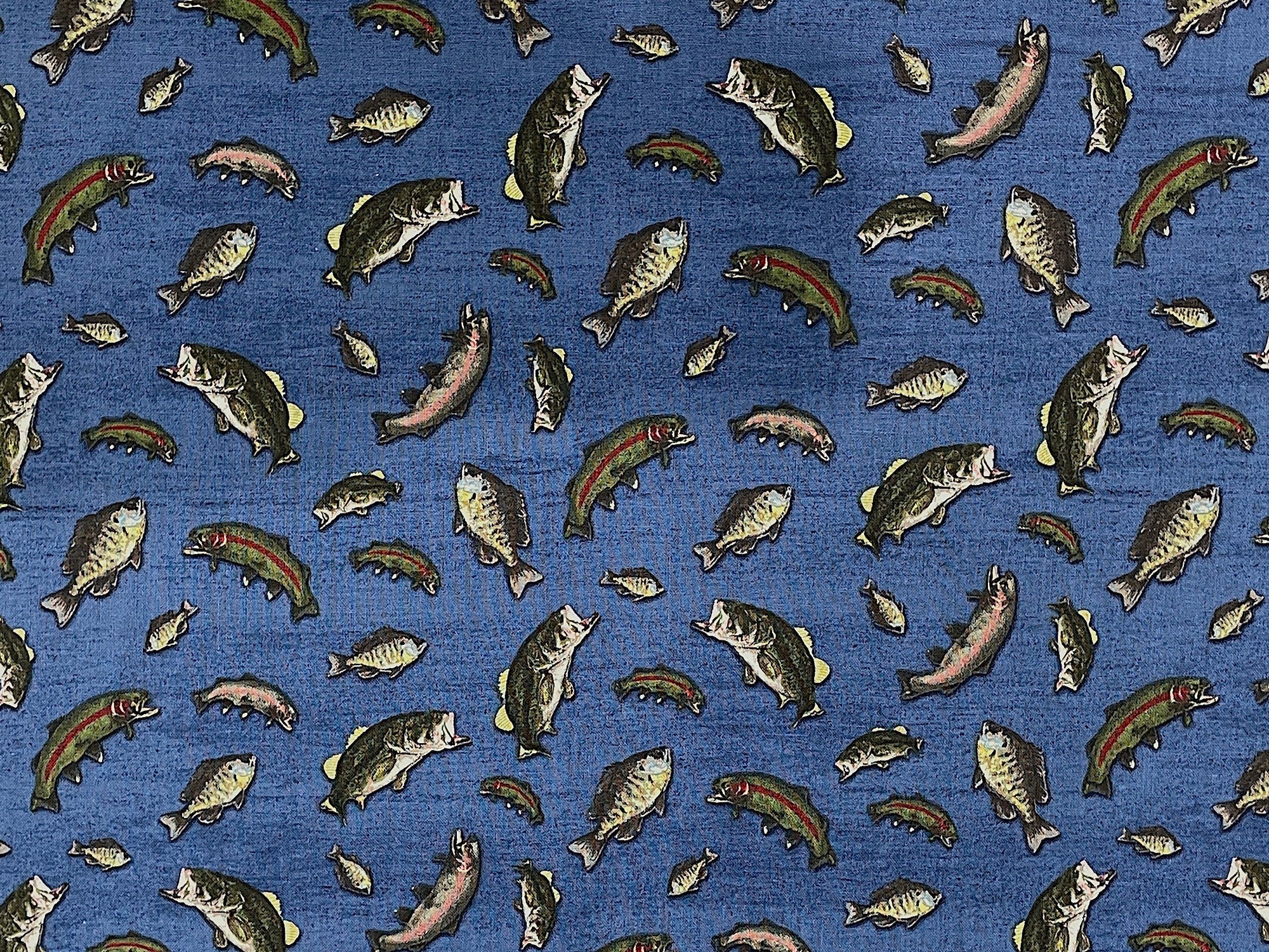 Blue cotton fabric covered with fish.