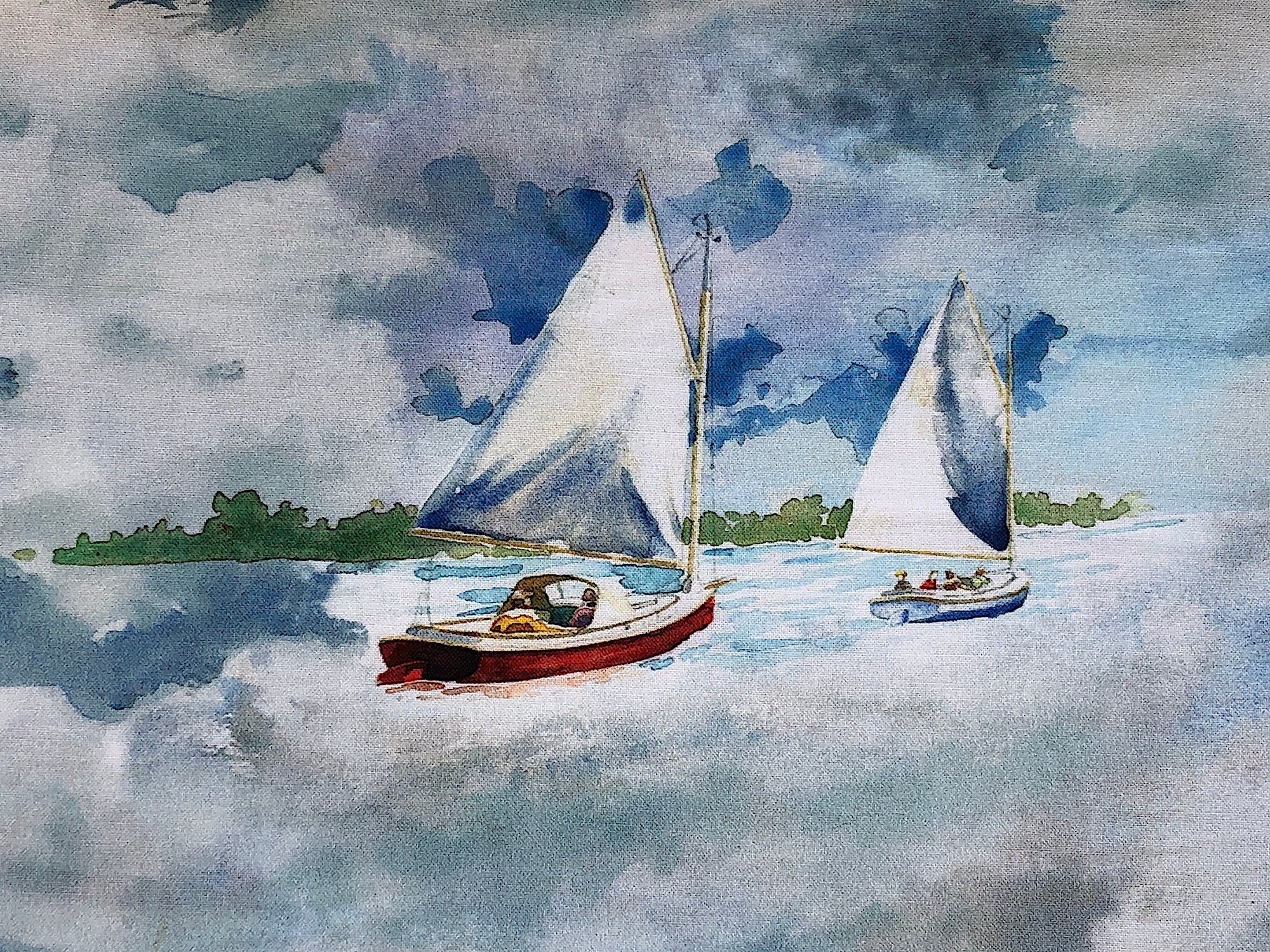 Close up of two sailboats in the water.