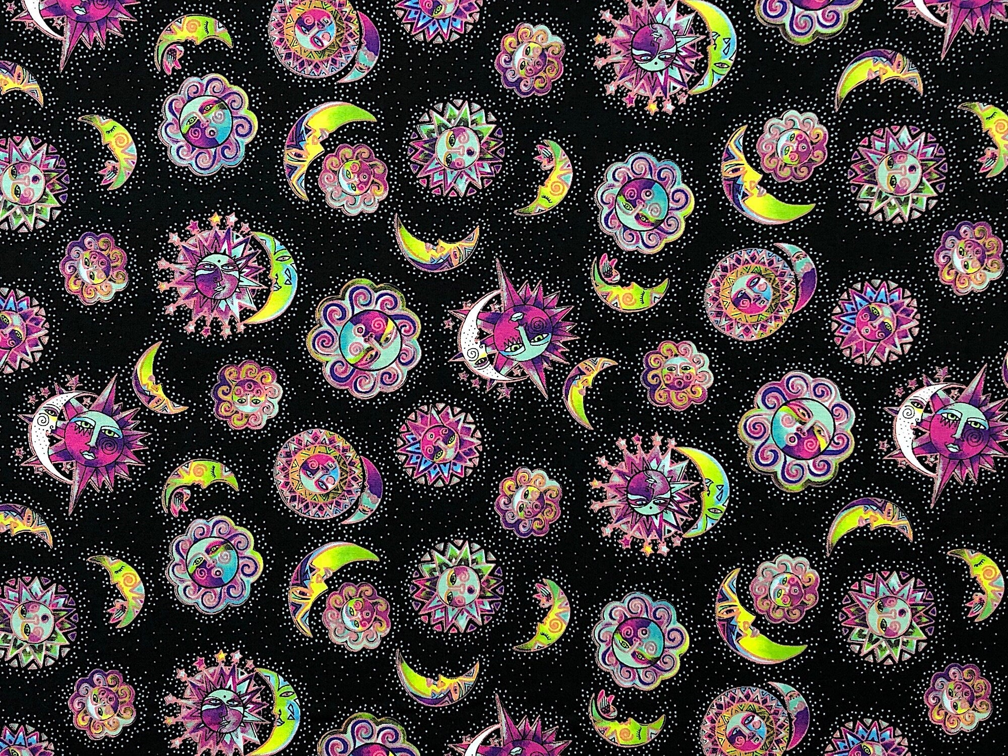 This black fabric is covered with suns and moons.