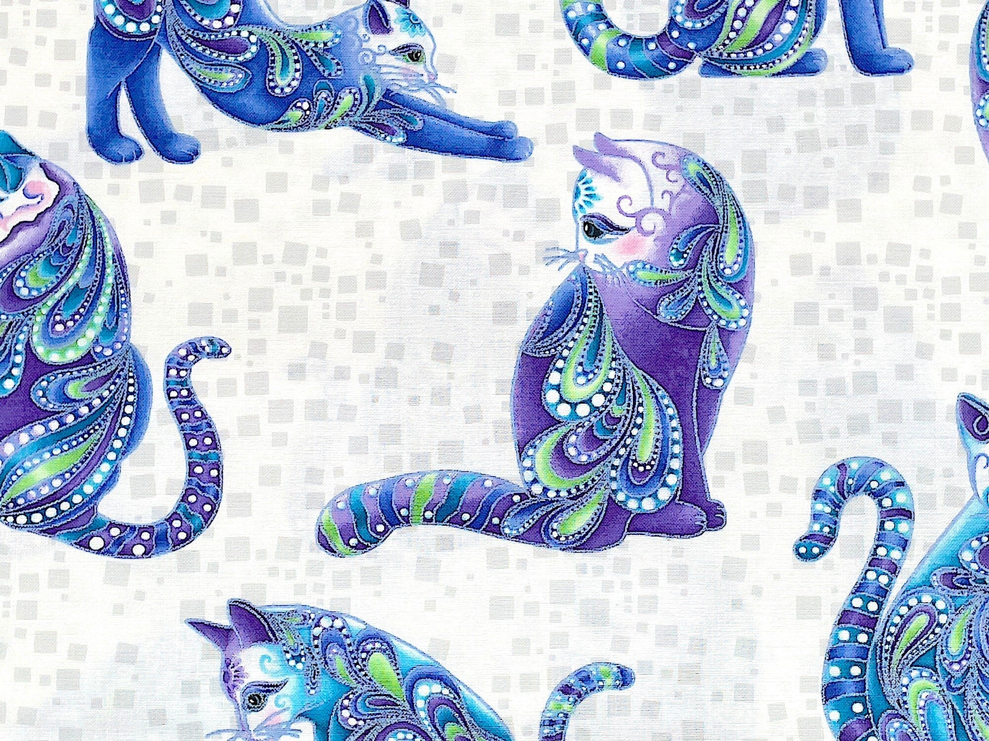 Close up of a paisley cat in blue, green, purple and white.