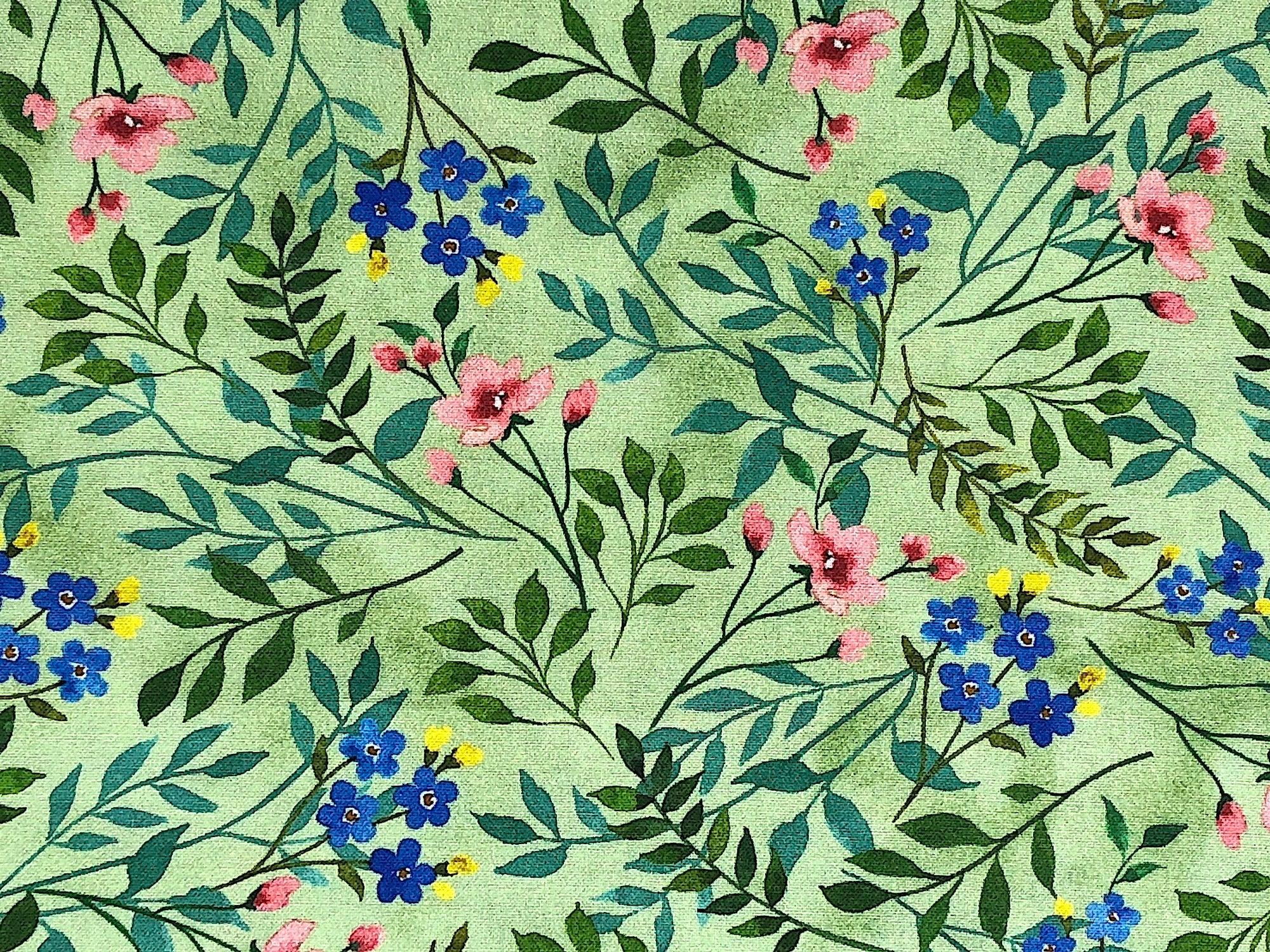 This pretty fabric is one from the Wildflower Farm Collection. Artist Jane Maday focuses on wildflowers in this collection. The colors are soft and cozy. This design has Pink, Blue, & Yellow Wildflowers - on a pretty Green Background. Combine this design with others from the collection for a garden lover's quilt and home decor accents