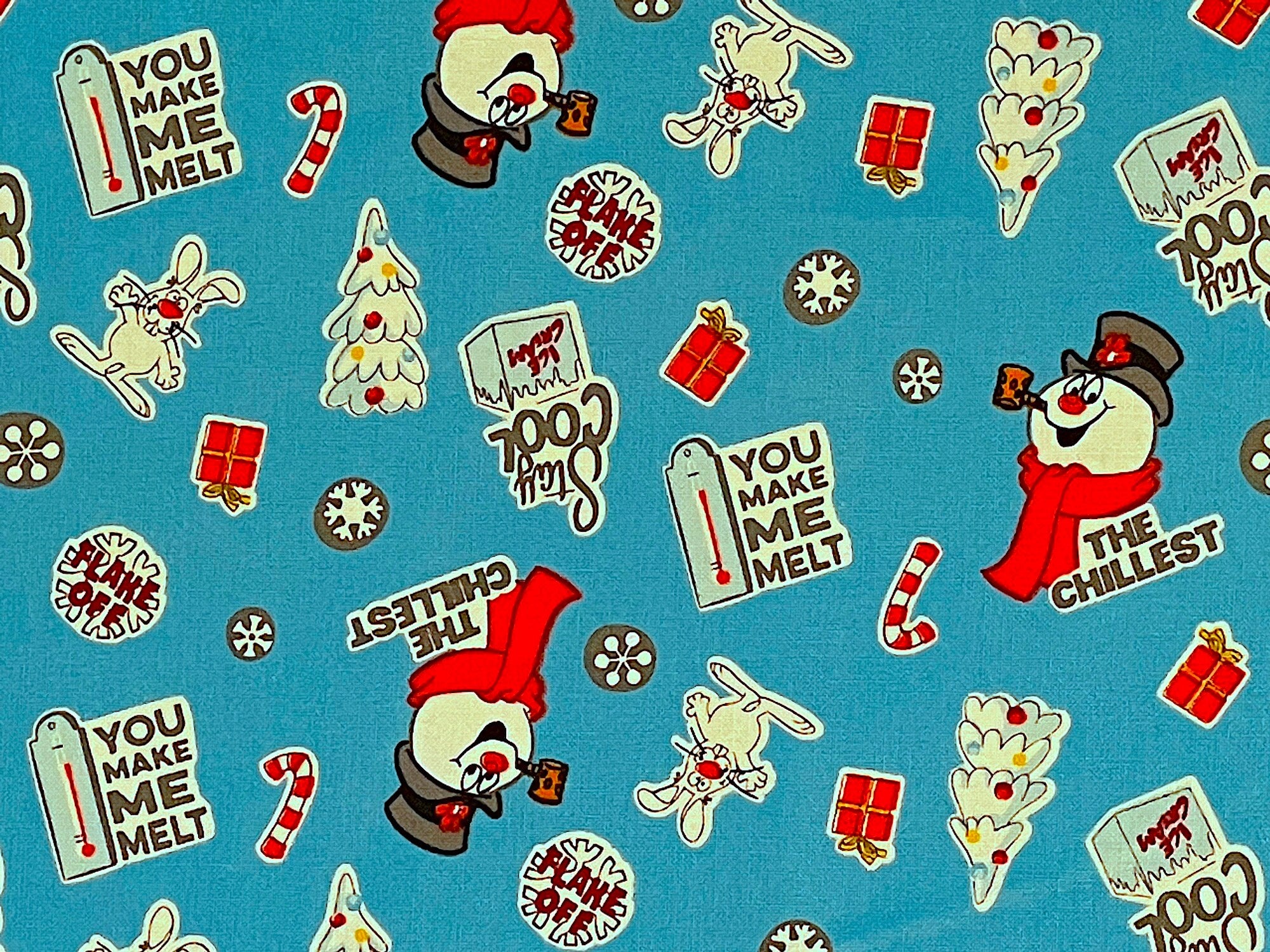 Blue cotton fabric covered with Frosty the Snowman, trees, candy canes, rabbits and snowflakes.