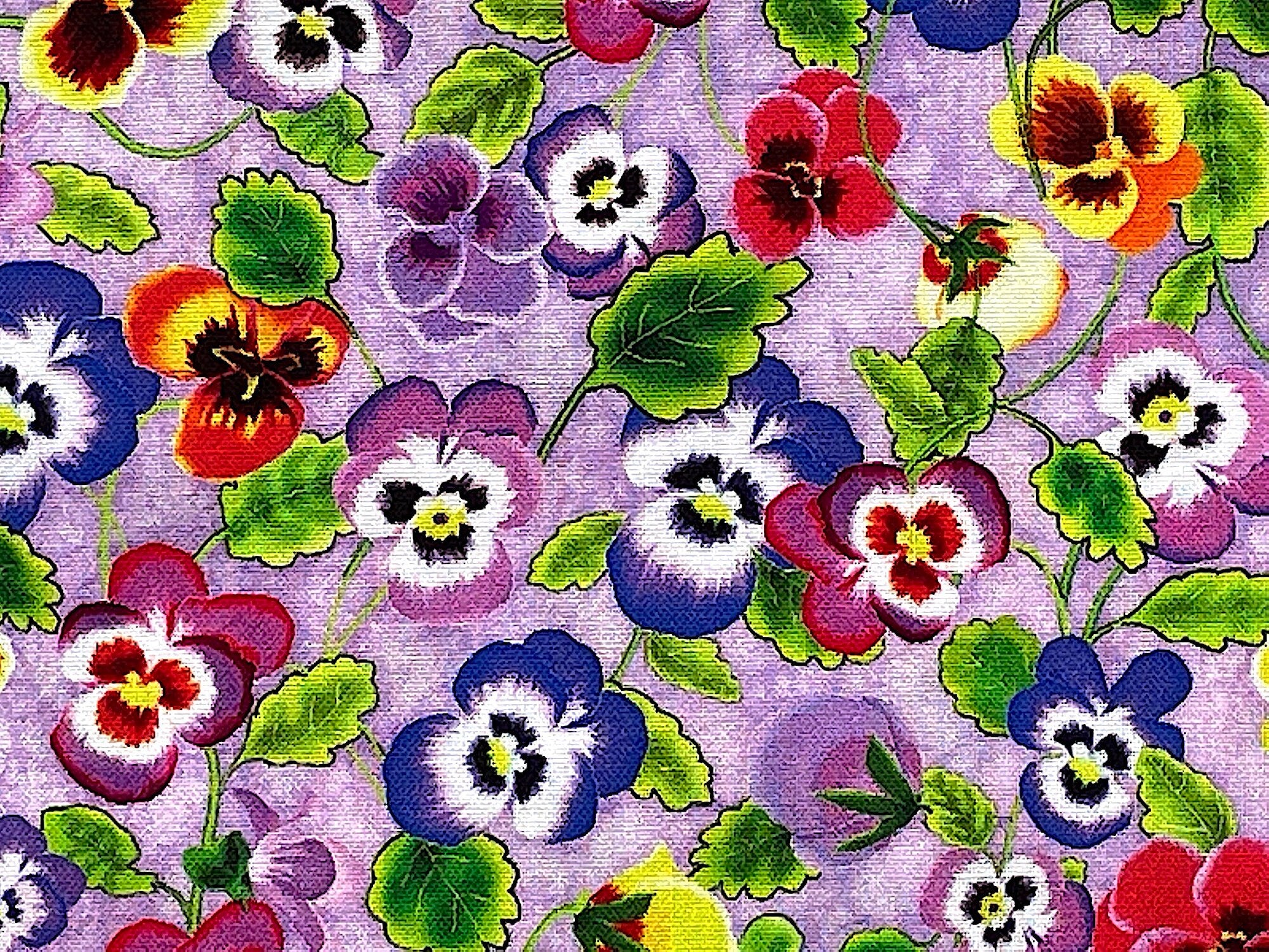 Close up of lavender cotton fabric covered with pansies and leaves.