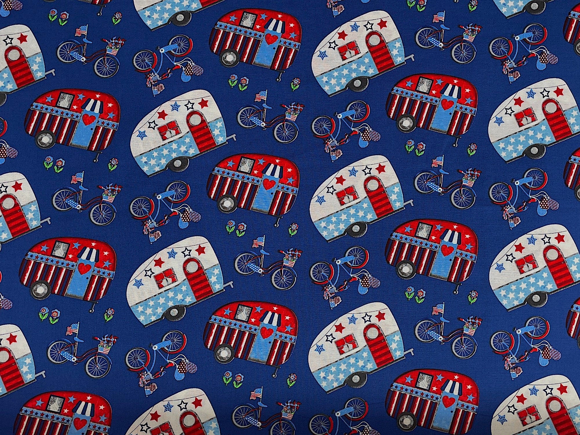 Blue cotton fabric covered with travel trailers.