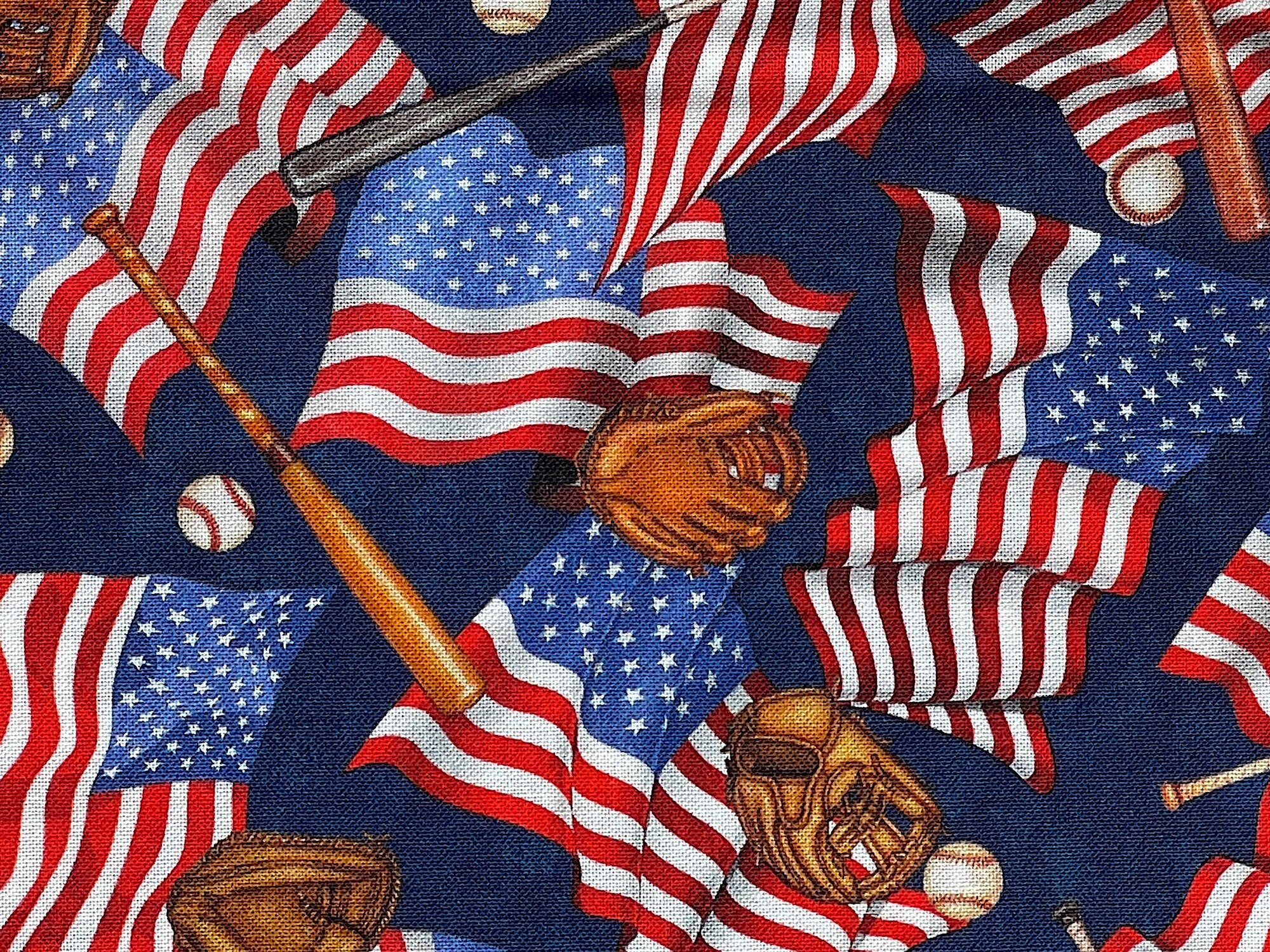 Close up of USA flags, baseball bats, balls and gloves.