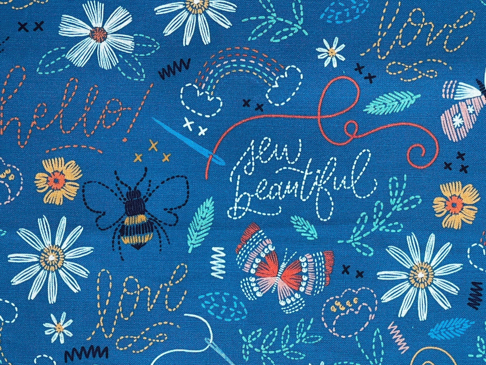 Close up of sayings such as sew beautiful, love, hello and more.