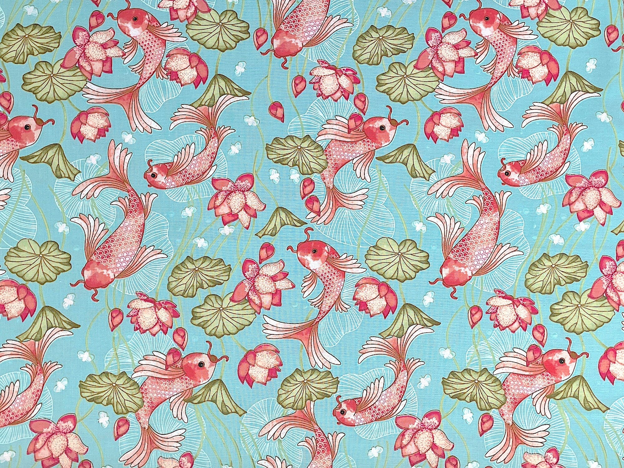 This fabric is part of the Koi Garden collection by Nancy Archer. This light teal cotton fabric is covered with orange koi and water lilies