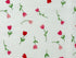 Close up of red and pink tulips and green stems and leaves on a white background.