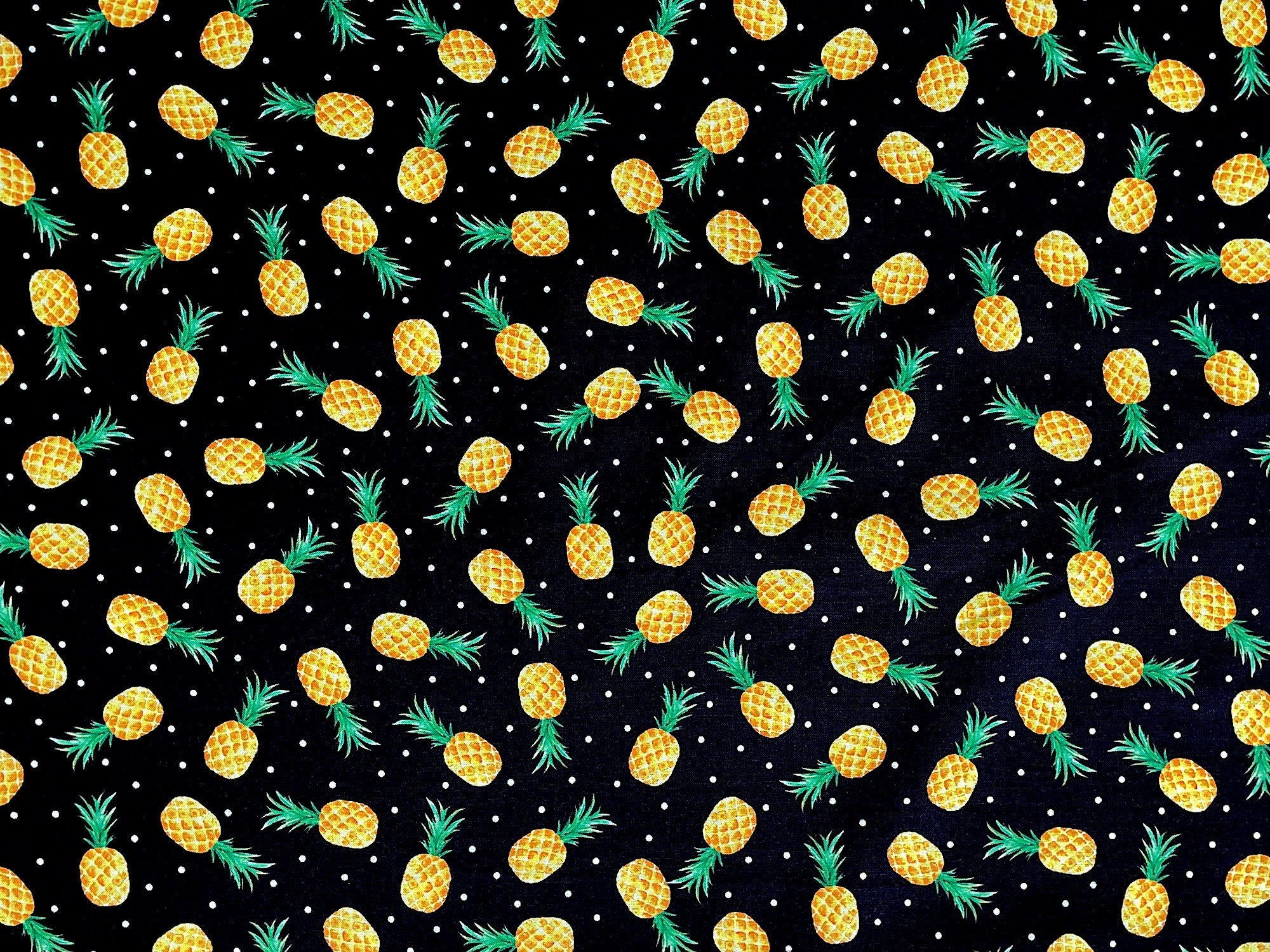 This fabric is part of the Fun In The sun collection and is covered with yellow pineapples.