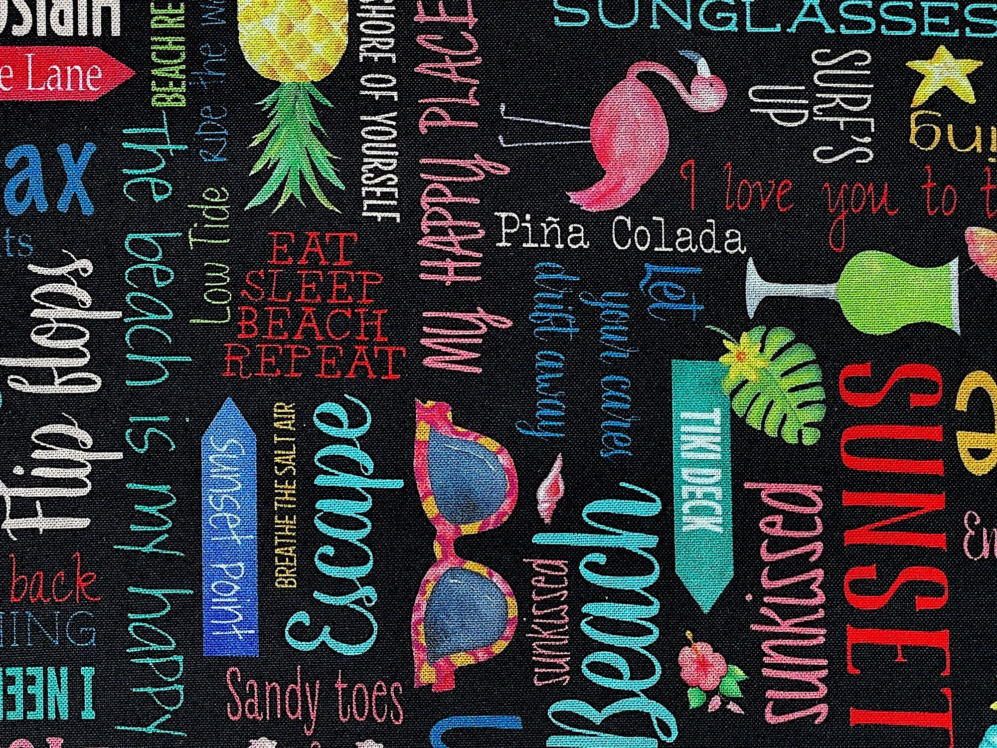 Close up of sayings such as pina colada, eat sleep beach repeat, sunset, escape and more.