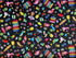 This fabric is part of the Fun In The sun collection. This black cotton fabric is covered with sunglasses, pineapples, pink flamingos, beach chairs, sand pail and shovels, beach signs and beverages