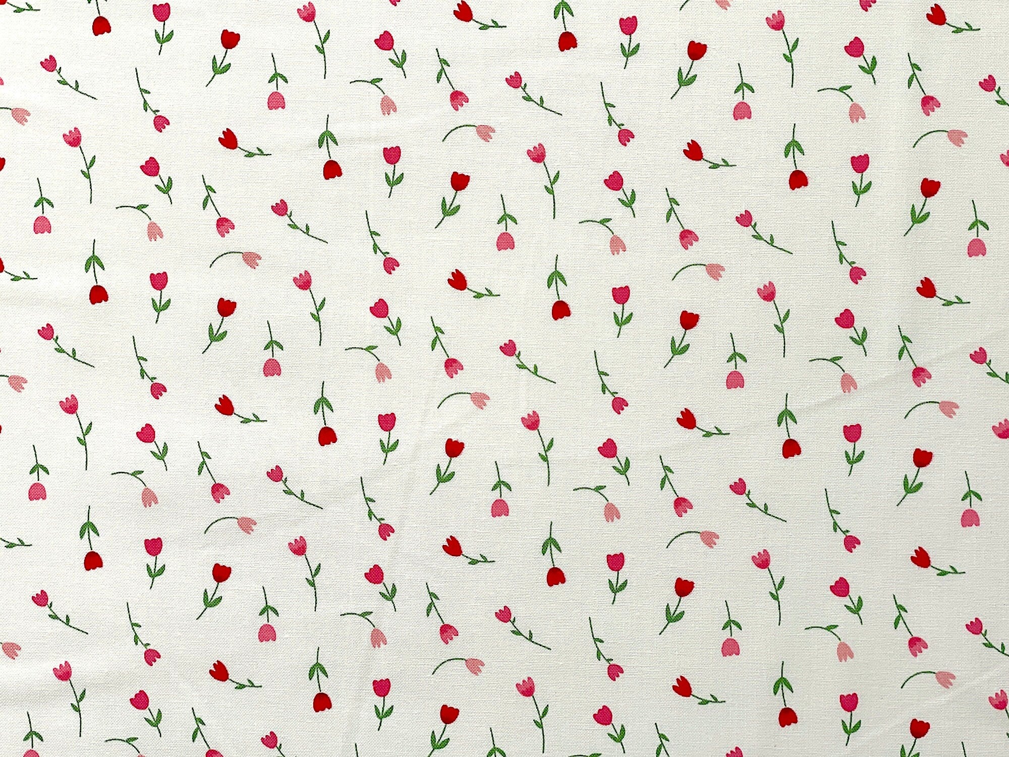 Falling In Love by Dani Mogstad for Riley Blake Designs. This fabric features red and pink tulips on a white background.