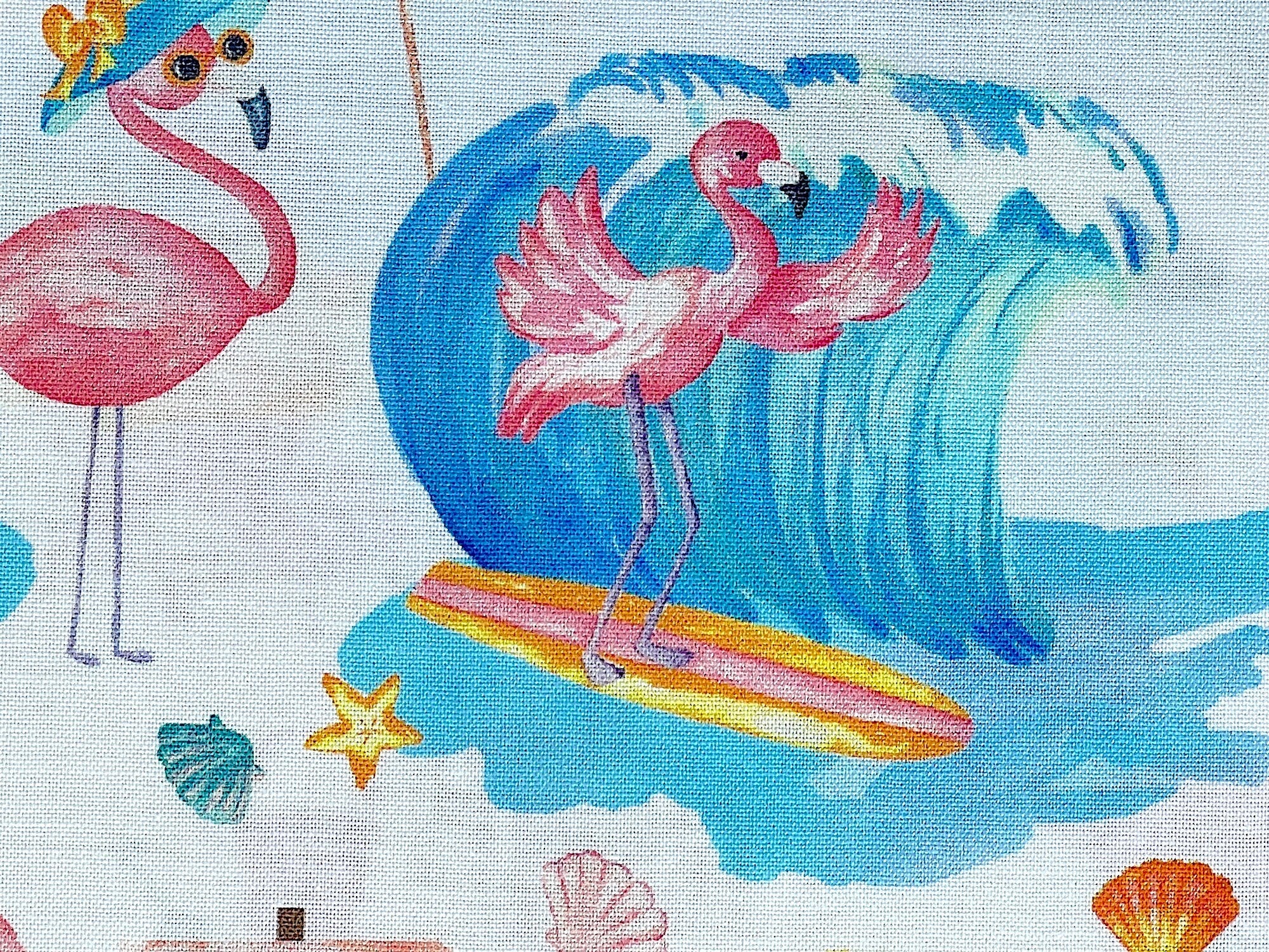 Close up of a flamingo surfing in the water.