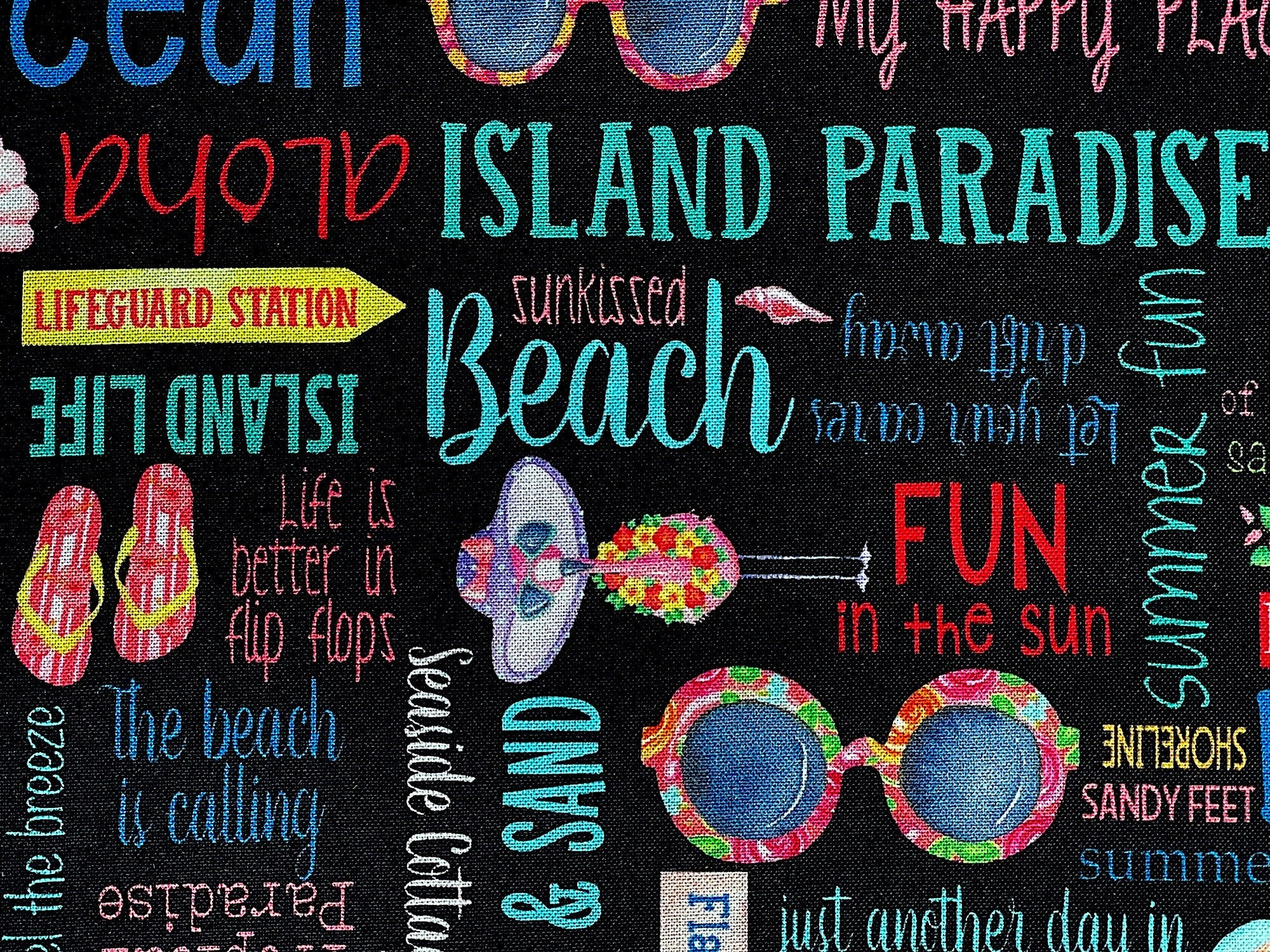 Close up of sayings such as island paradise, beach, fun in the sun and more.