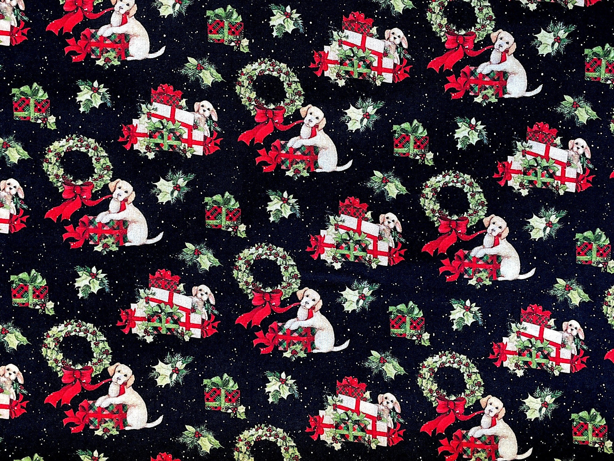 This Christmas themed fabric is covered with dogs, presents, wreaths and more. The dogs are either laying on the presents or have their paws on them just waiting to open them.