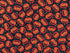 This fabric is called Trick & Treat Pumpkin toss and is covered with Jack-o-lanterns. The black background also has small yellow dots throughout the fabric.