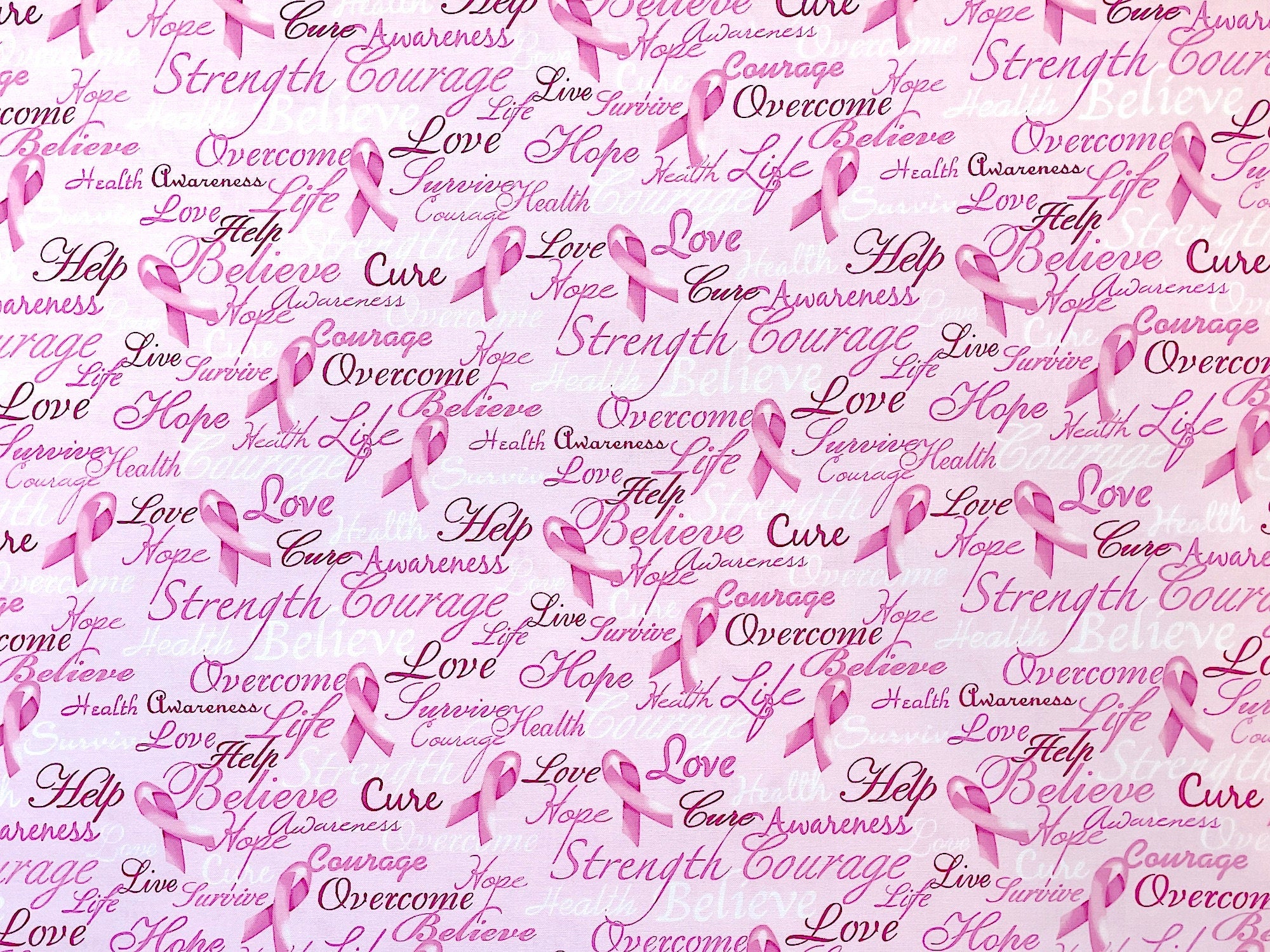 This pink awareness fabric is covered with words such as love, hope, cure, believe, awareness, help, strength, overcome and more. There are also pink ribbons throughout the fabric