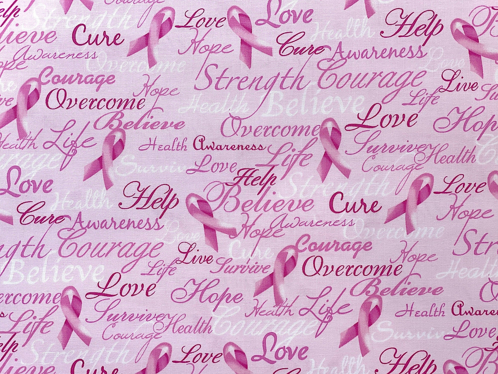 Close up of sayings such as overcome, life, love, help, cure, awareness and more.