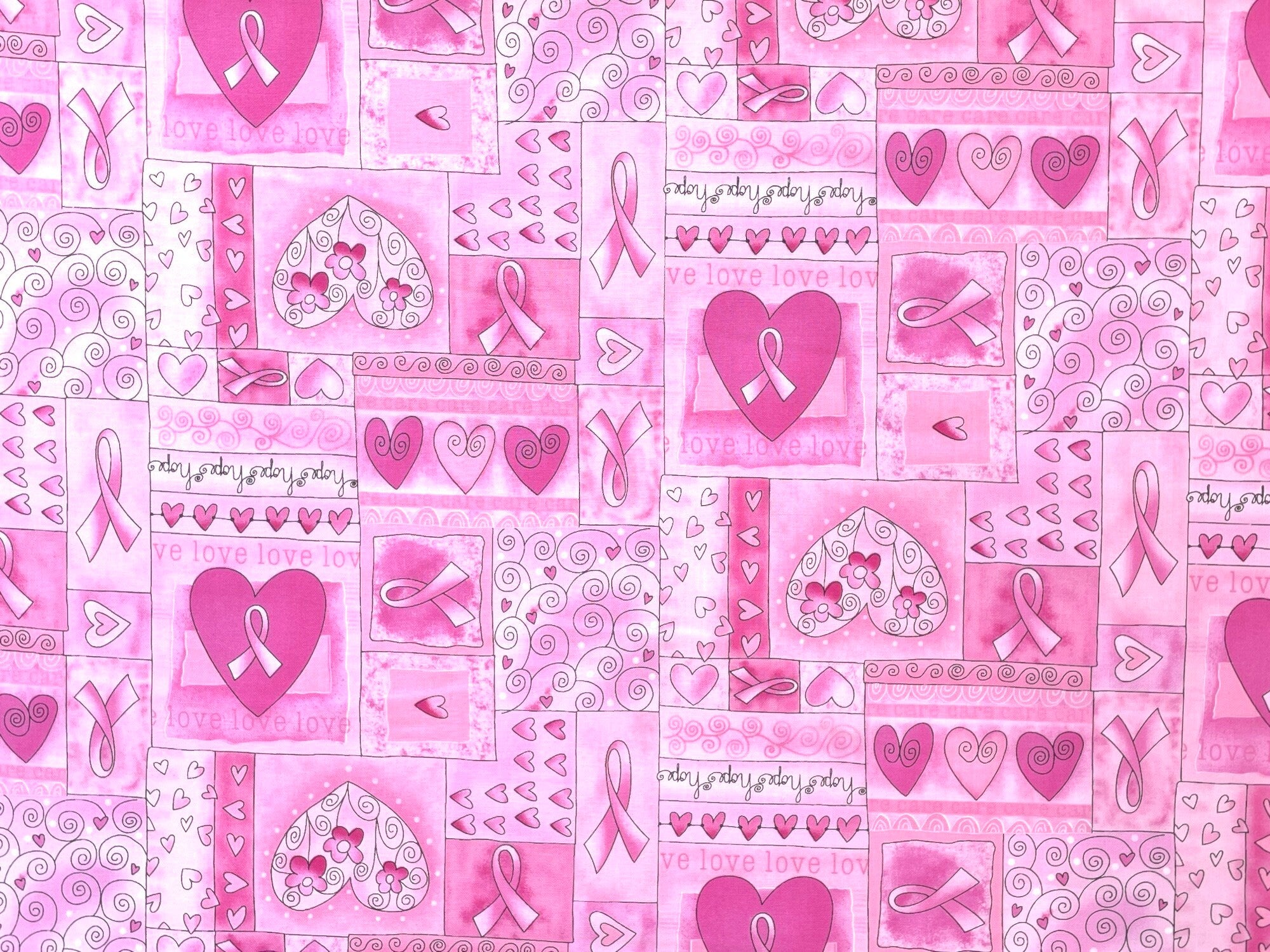 This pink awareness fabric is covered with hearts and ribbons that have various shades of pink.
