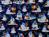 This dark blue cotton fabric is covered with snowmen, wildlife and snowflakes. This fabric is part of the Flurry Friends collection by Henry glass