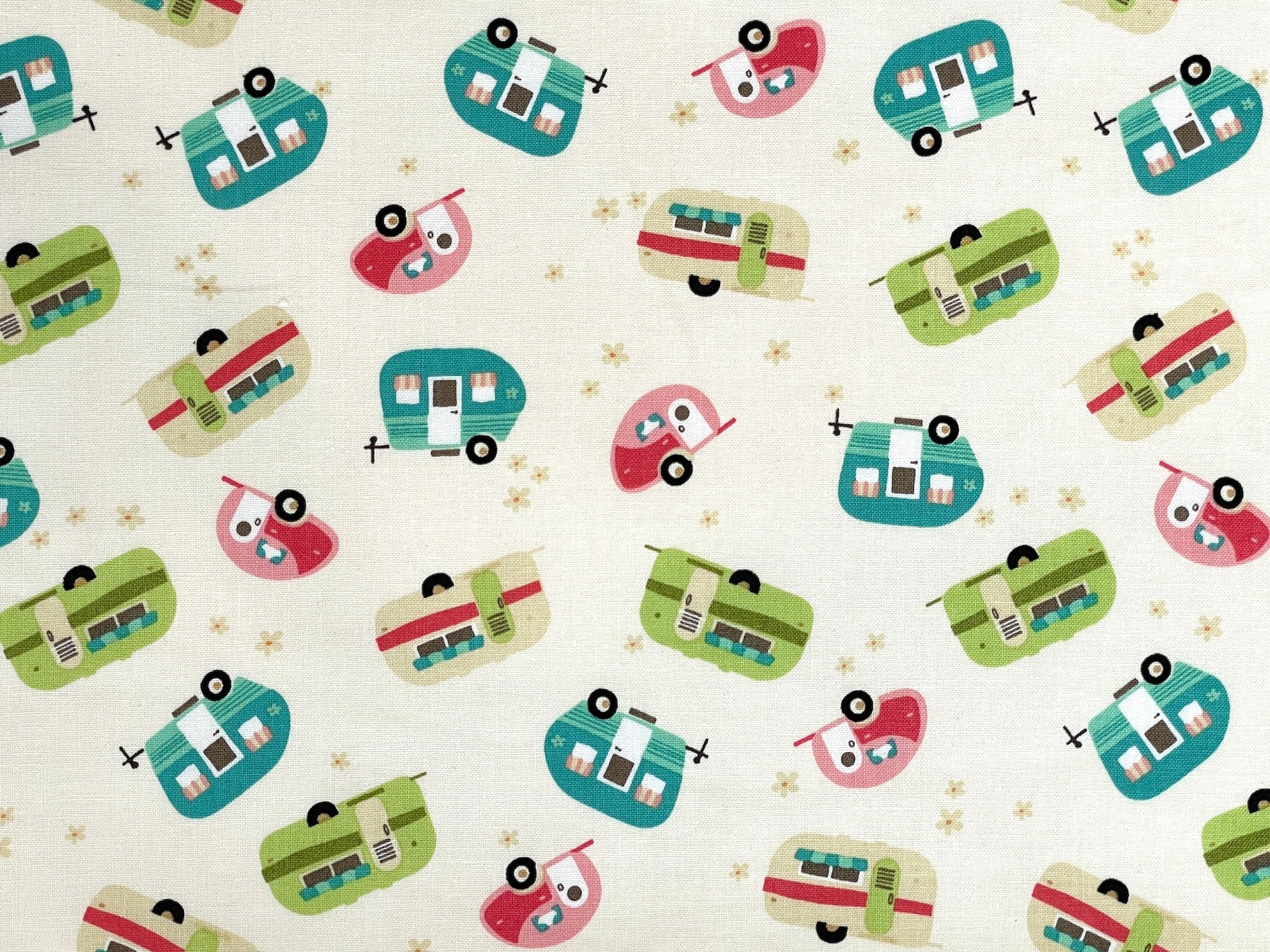 This fabric is called Glamp Camp Travel Trailers. Travel trailers in shades of green, turquoise, tan and pink are tossed over a cream background