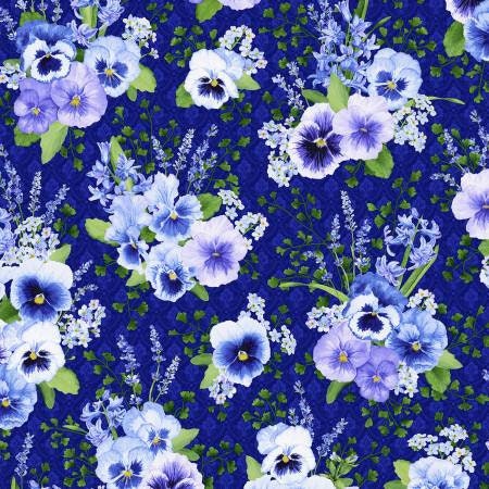 Purple cotton fabric covered with bunches of purple and white pansies and green leaves.