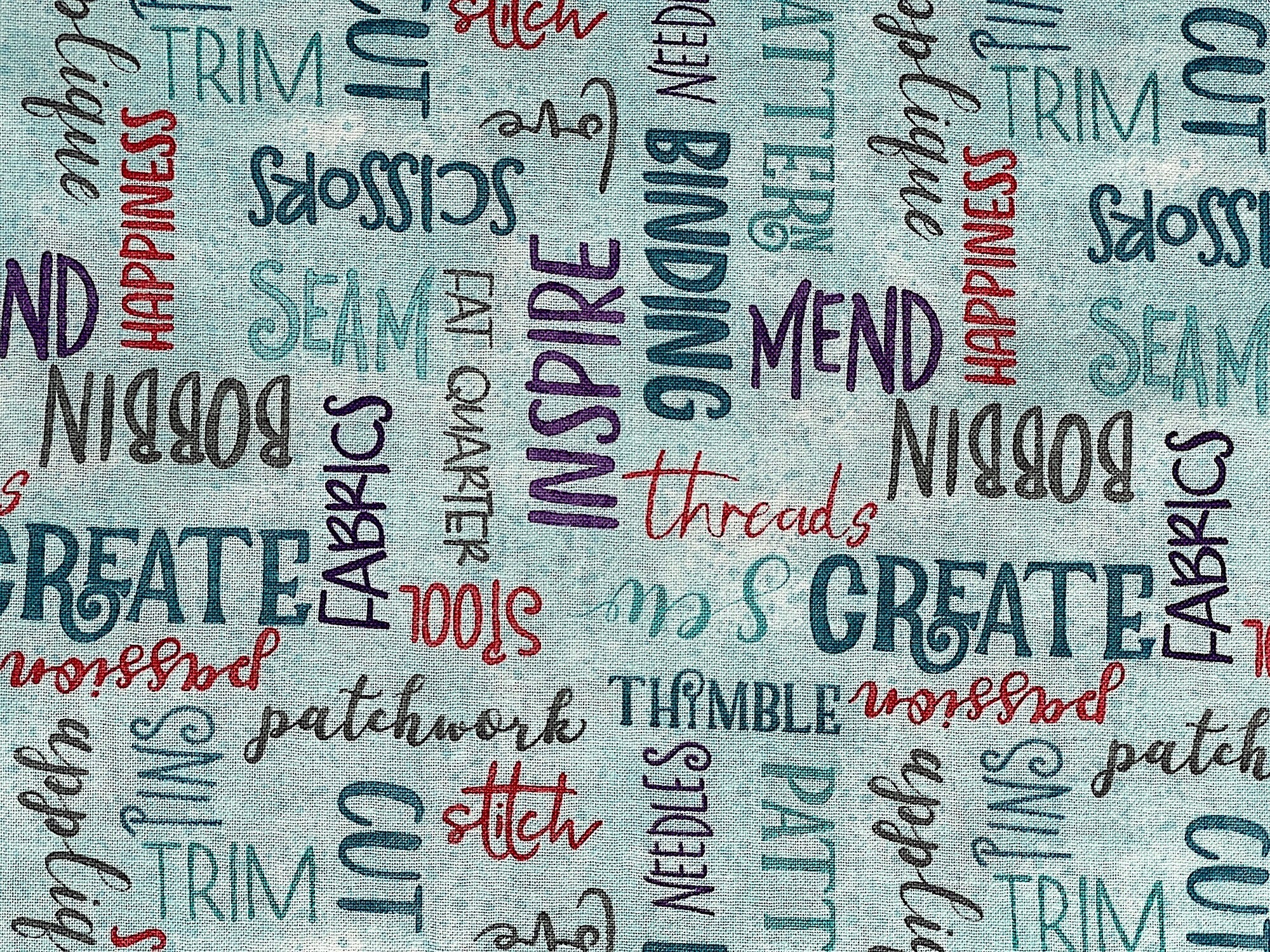 Close up of sayings such as inspire, create, mend, threads and more.