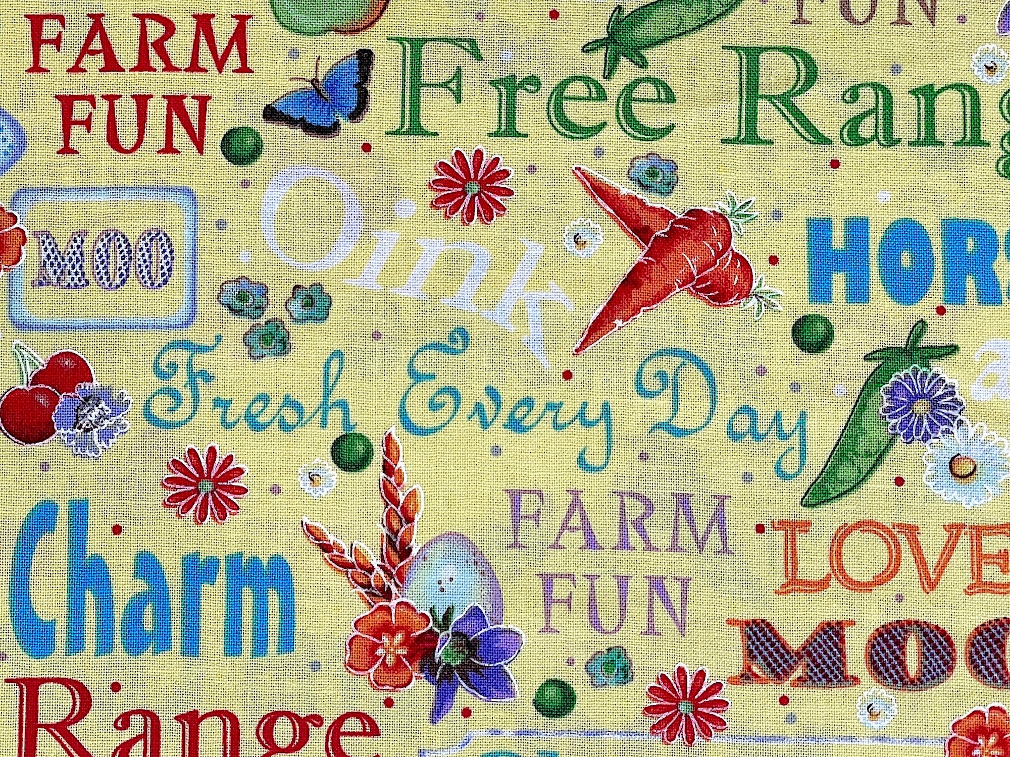 This yellow cotton fabric is covered with farm sayings such as farm charm, free range, fresh every day, farm fun horsing and more. There are also eggs, peas, apples, pears, cherries, flowers and more scattered throughout this fabric.