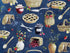 Blue cotton fabric covered with pies, silverware and berries.