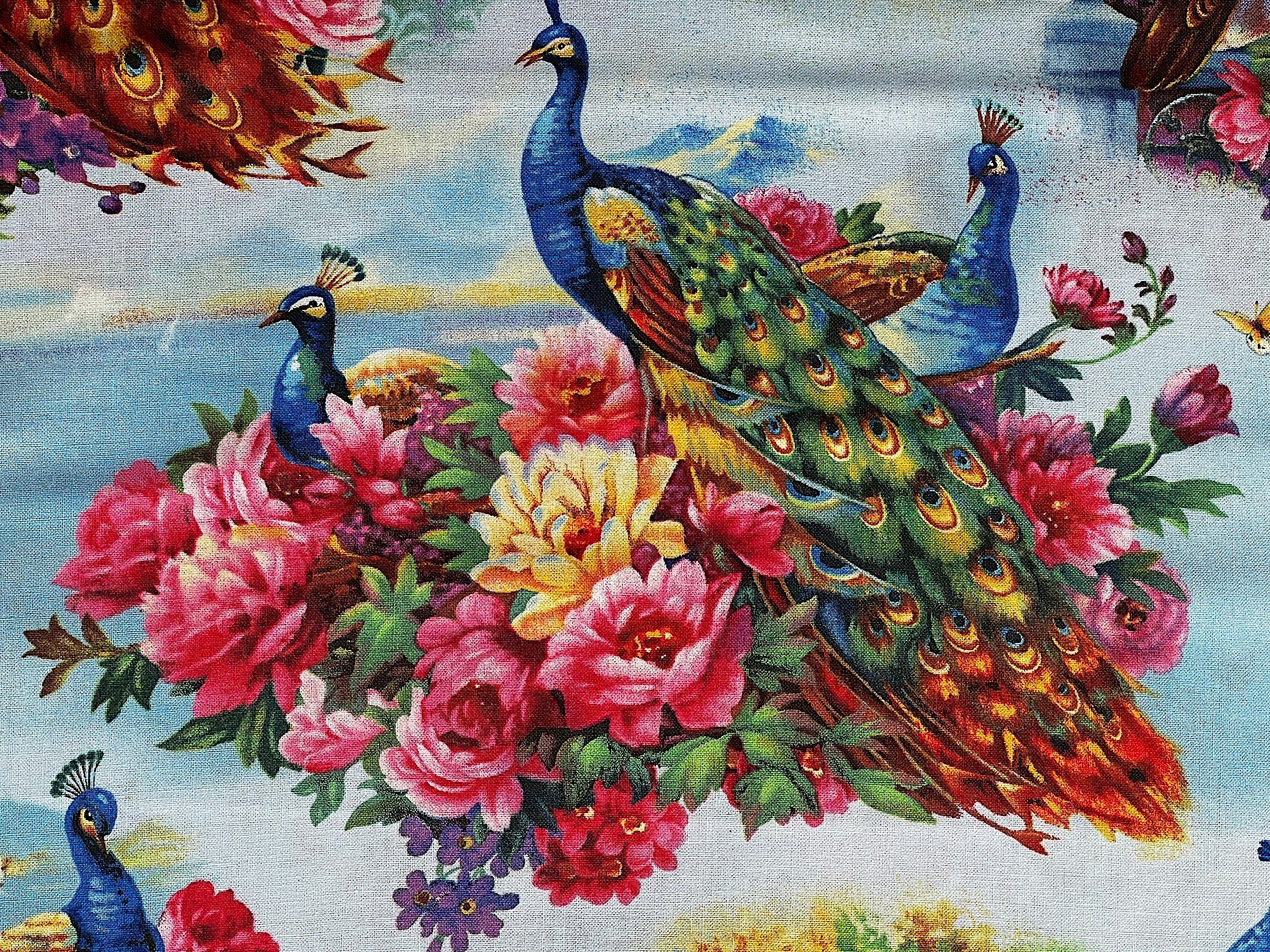 Close up of peacocks and flowers.