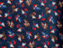 Blue cotton fabric covered with red, white and blue roosters.
