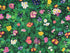 This fabric is called Multi Garden Florals and is covered with yellow, pink, purple and white primrose plants with green leaves