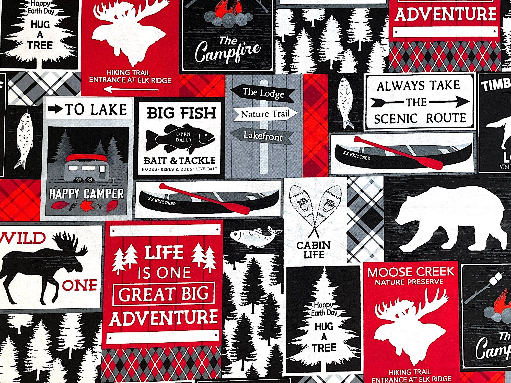 This fabric is called Cabin Life and is part of the Great Outdoors collection by Kanvas Studio. This black, white and red fabric is covered with rv's, fish, wolf, canoes, elk, campfires, trees and more. Various sayings such as the campfire, happy earth day hug a tree, to lake and more are printed throughout the fabric