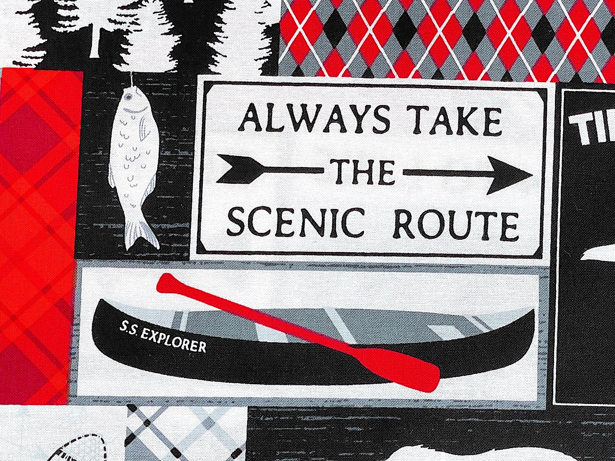 Close up of a canoe and a sign saying always take the scenic route.