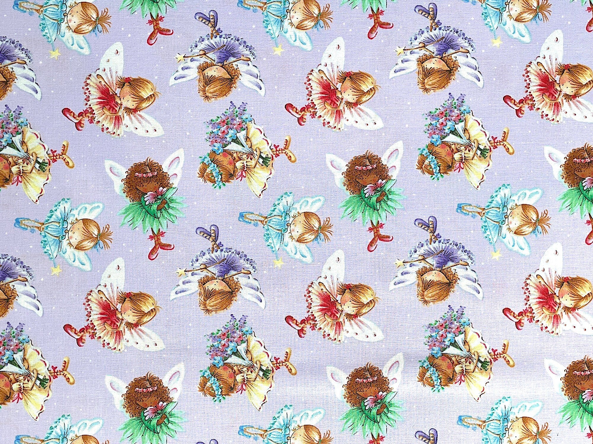 This fabric is part of the Fairy Garden collection by Studio E Fabrics. This lavender fabric is covered with Child Fairies wearing purple, green, yellow dresses. They also have wands in their hands.