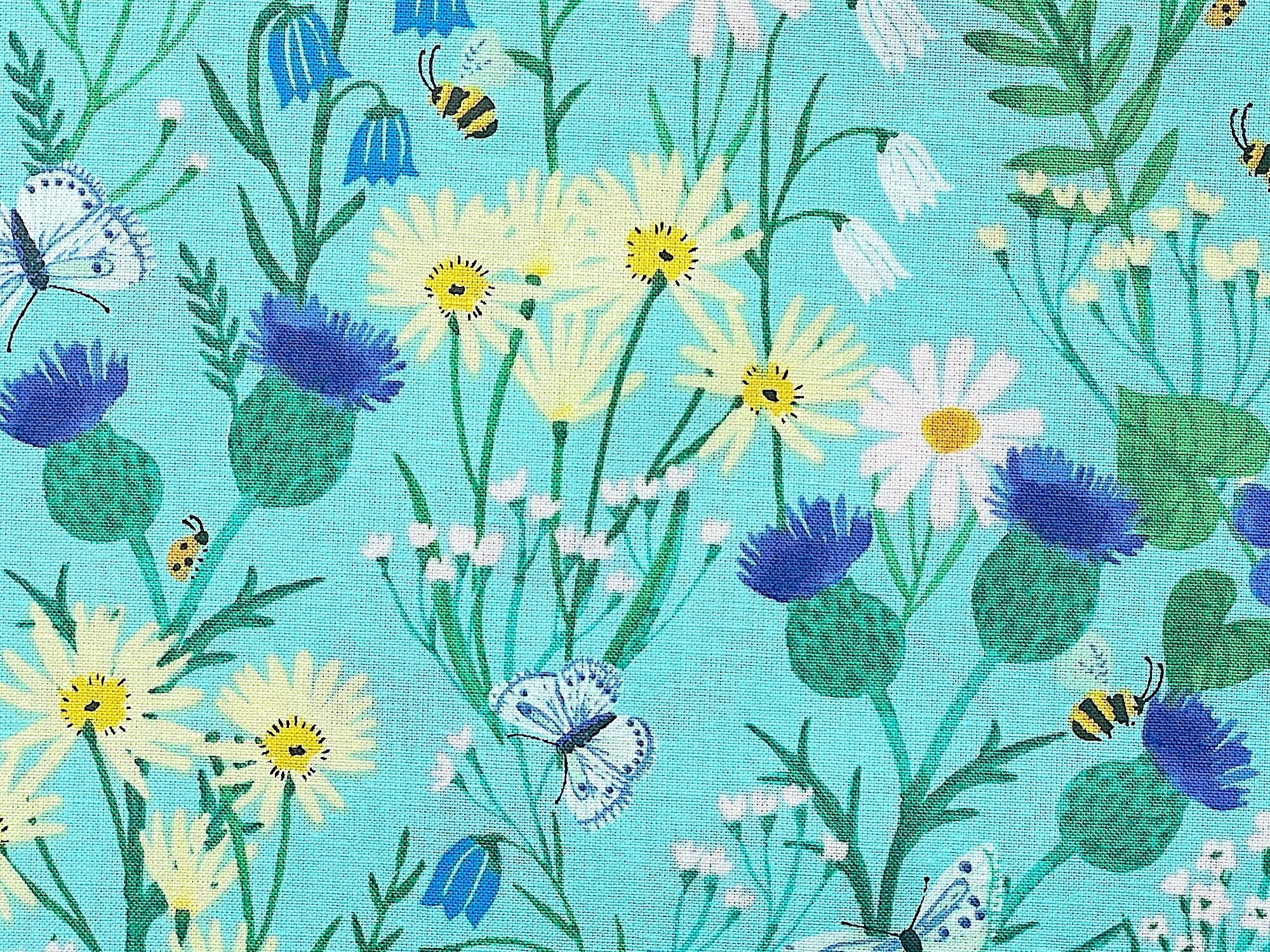 Close up of wildflowers, butterflies and bees.
