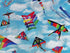 Close up of kites in the cloud covered sky.