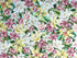 Part of the Lanai collection by Maywood Studio this fabric is covered with white, pink and yellow flowers on an aqua background.