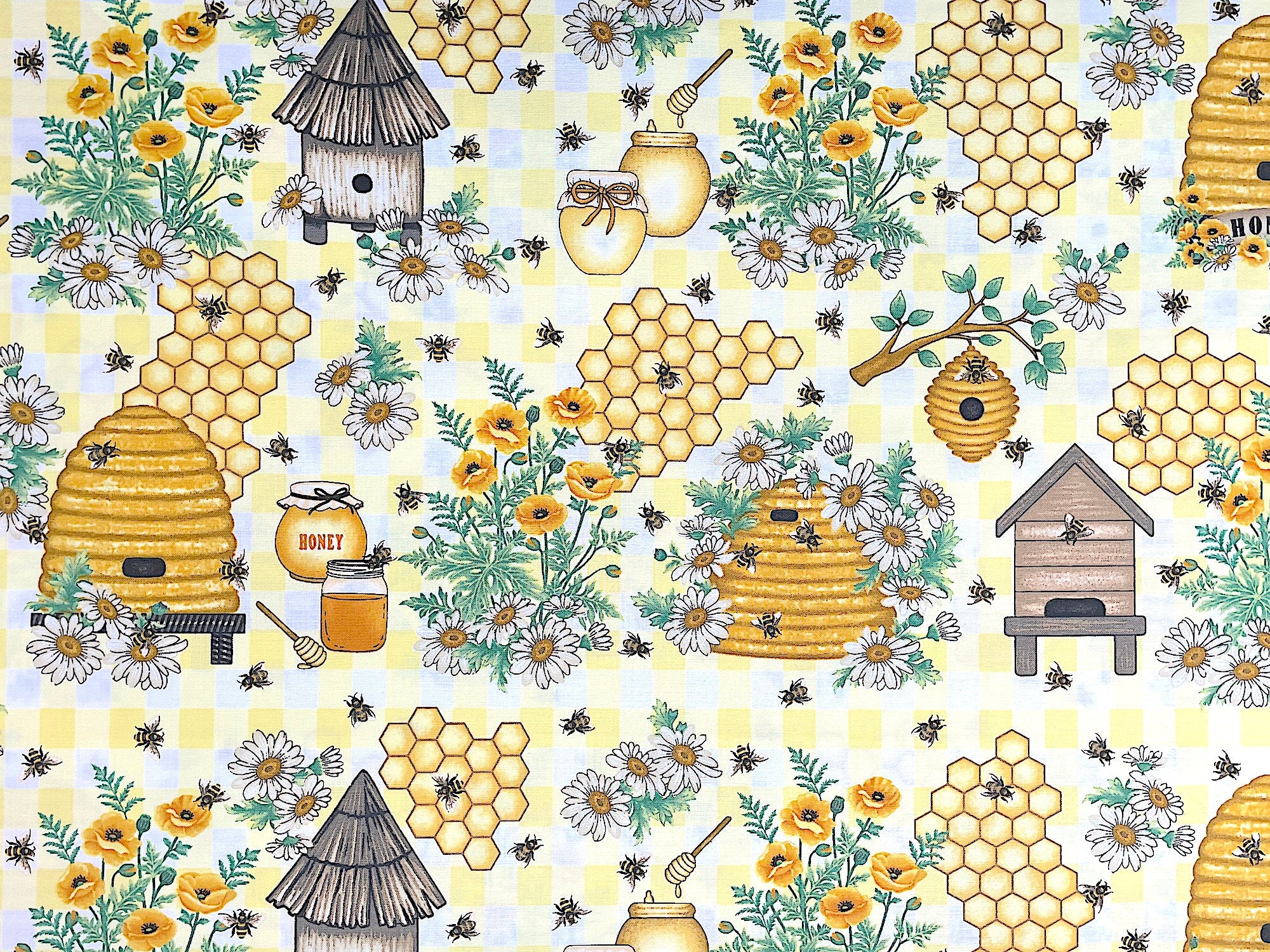 This fabric is part of the Bee All You Can Bee Collection by Art Loft. This yellow fabric is covered with bees, bee hives, bee houses, jars of honey and yellow poppies.