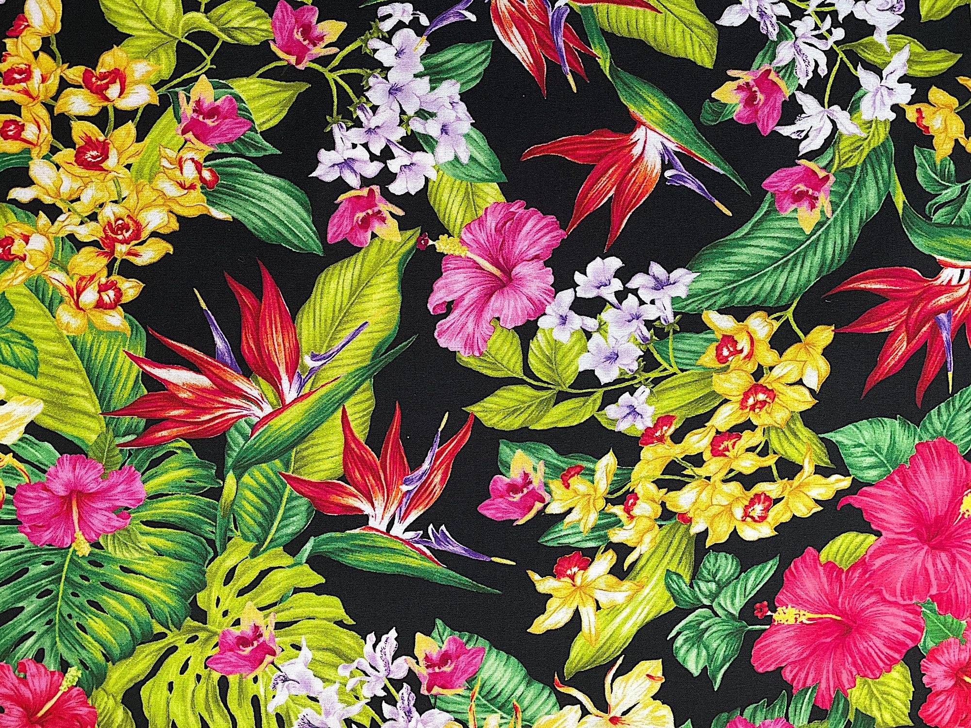 This Tropical flower fabric is part of the Tropical Escape collection by Kanvas Studio. This black fabric is covered with tropical flowers such as hibiscus and palm leaves.