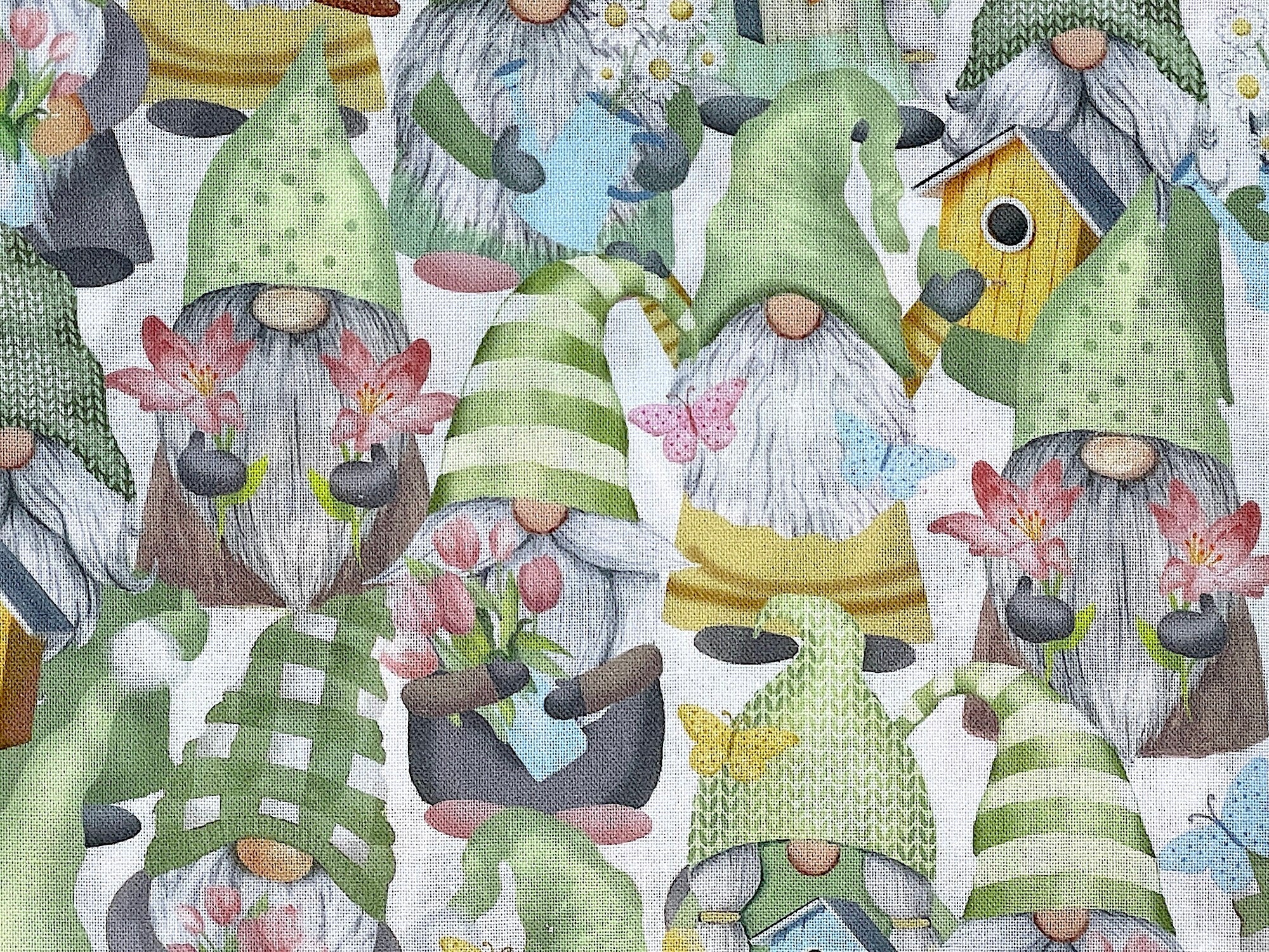 Close up of gnomes holding flowers.