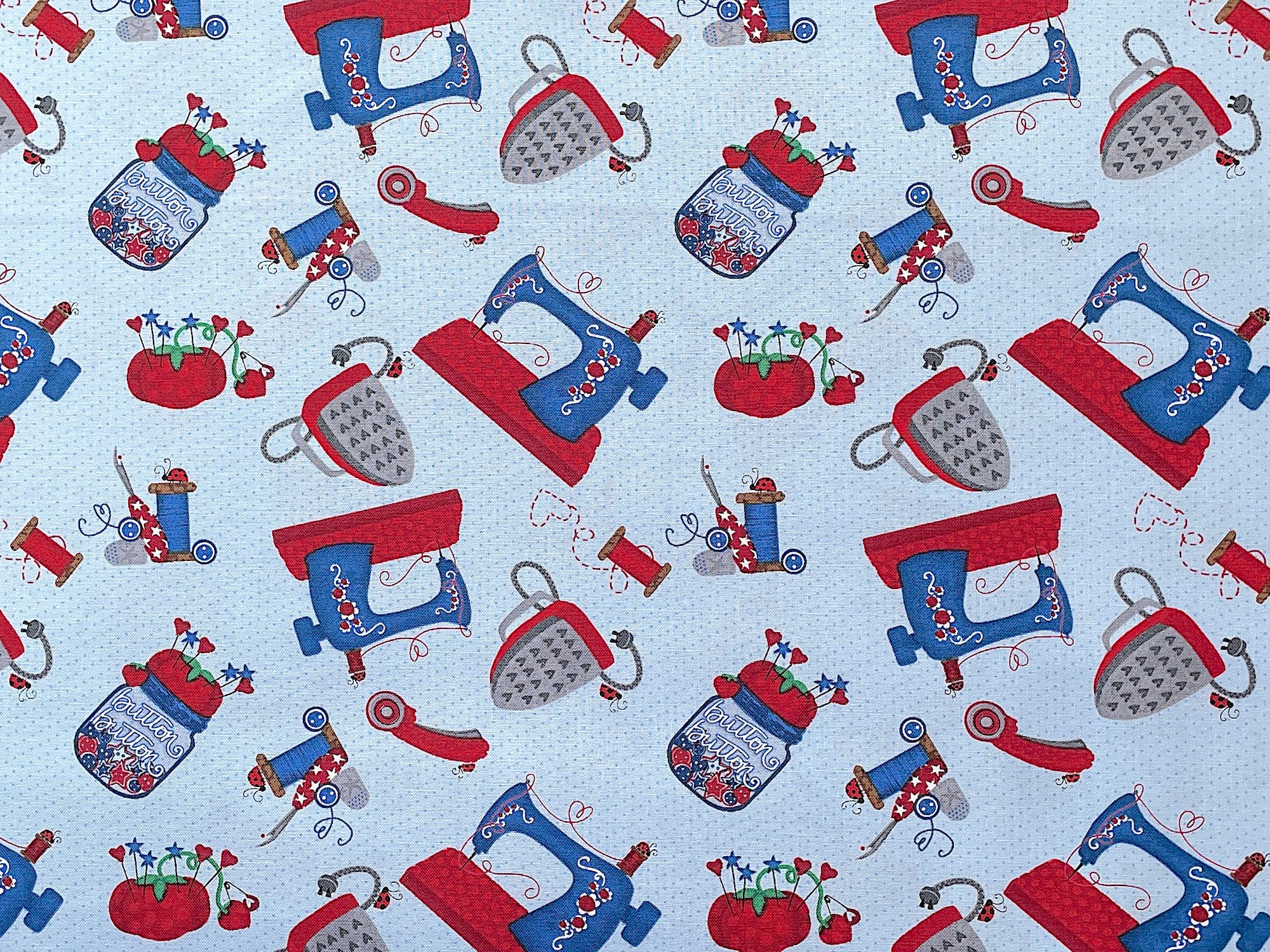 This fabric is part of the Sew Tweet Collection by Rena Askey. This blue cotton fabric is covered with sewing machines, thread and pin cushions.