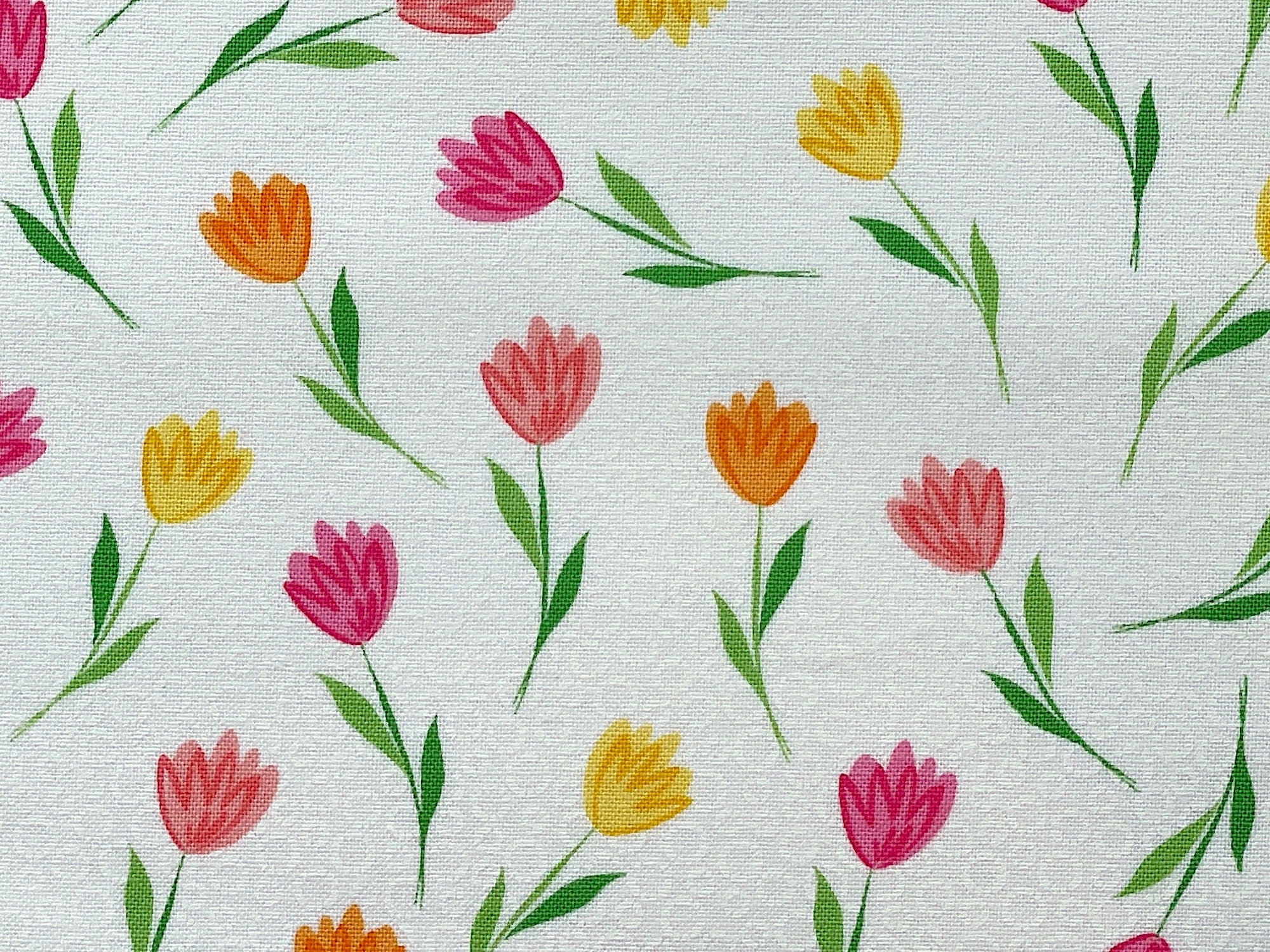 Close up of pink and yellow tulips.