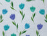 Close up of blue and green tulips and green leaves.