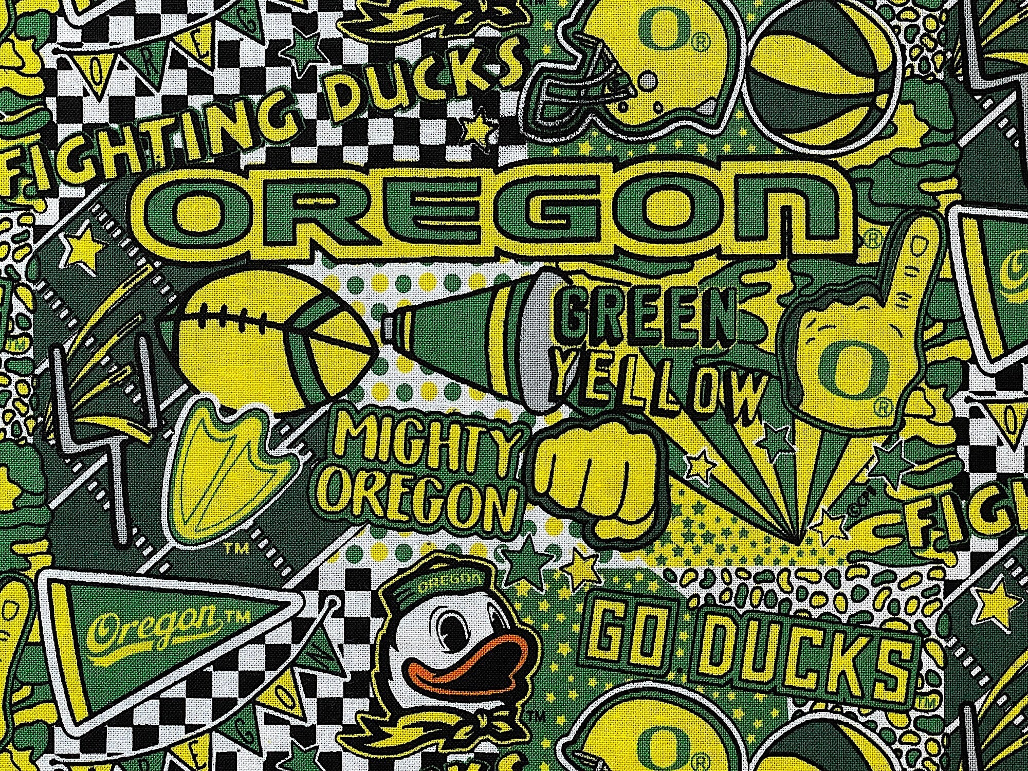 Close up of sayings such as Oregon, Green Yellow, Mighty Oregon, Go Ducks and more.