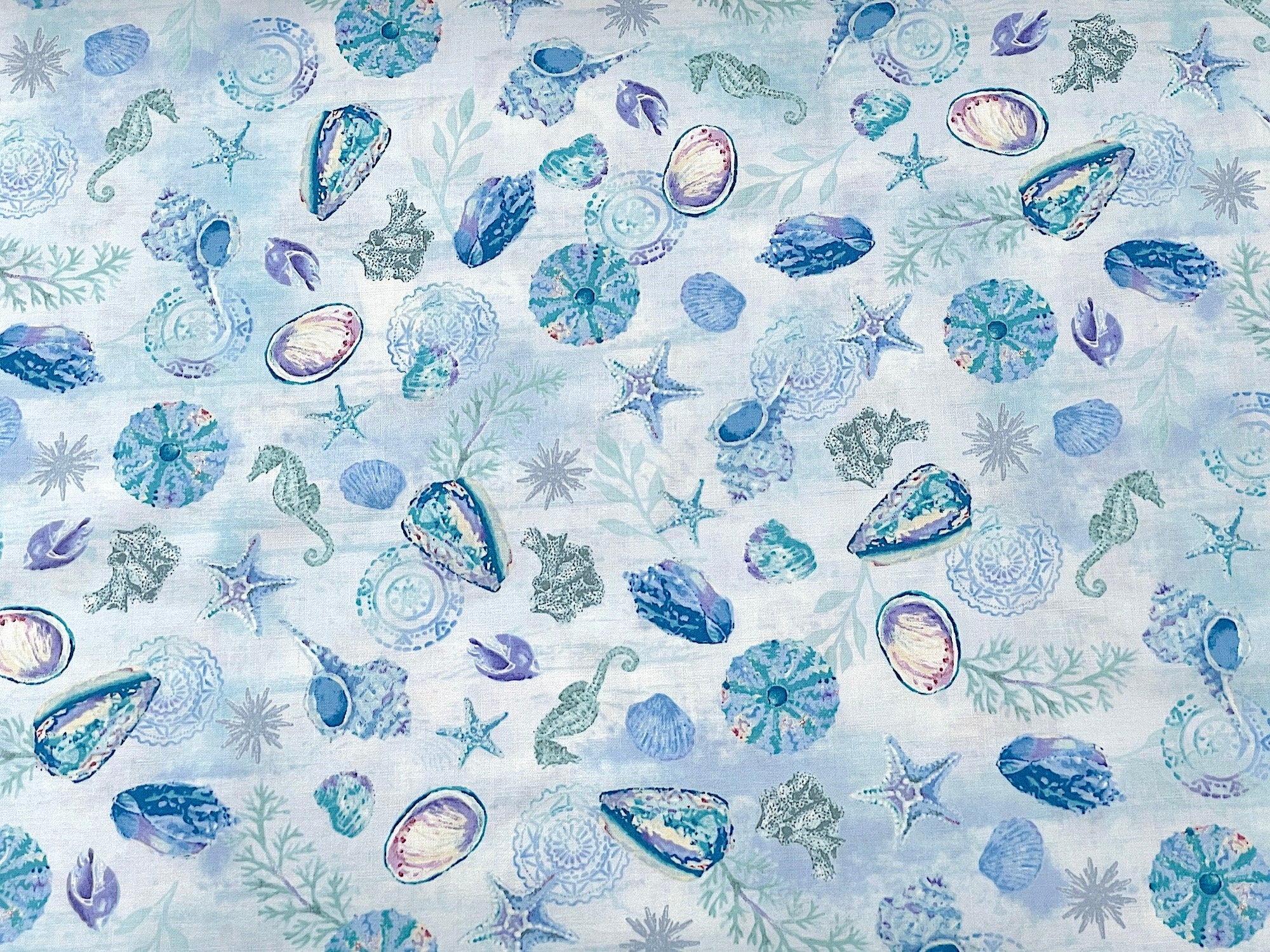 This light blue fabric is part of the Salt and Sea collection by Andrea Tachiera. This cotton fabric is covered with seashells, starfish and seahorses. See my other listings for more fabrics from this collection as seen in the last picture and video.