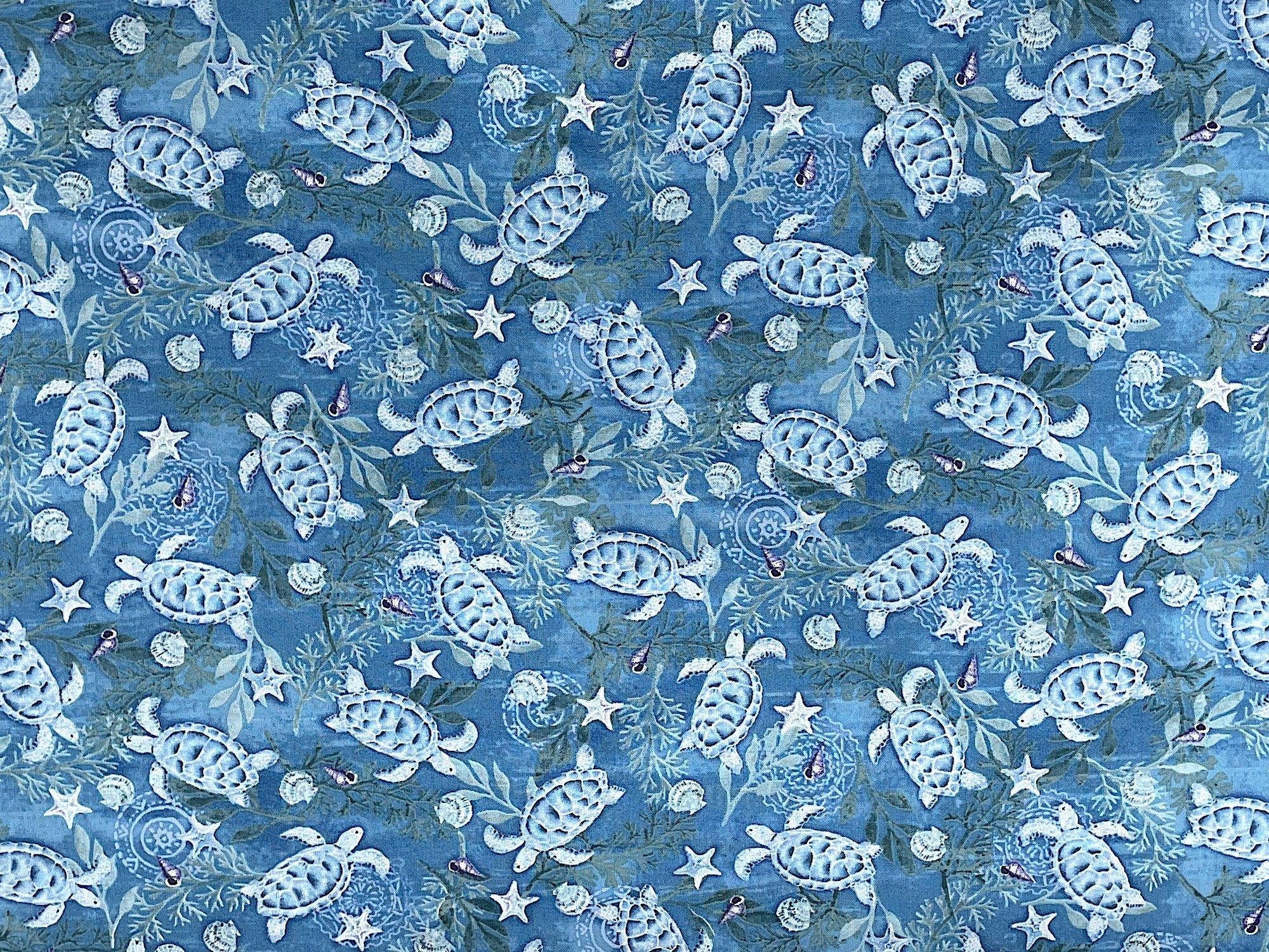 This blue fabric is part of the Salt and Sea collection by Andrea Tachiera. This cotton fabric is covered with turtles, starfish and sea shells and water plants. See my other listings for more fabrics from this collection as seen in the last picture and video.
