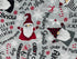Close up of  a gnomes, snowflakes, candy canes and sayings.