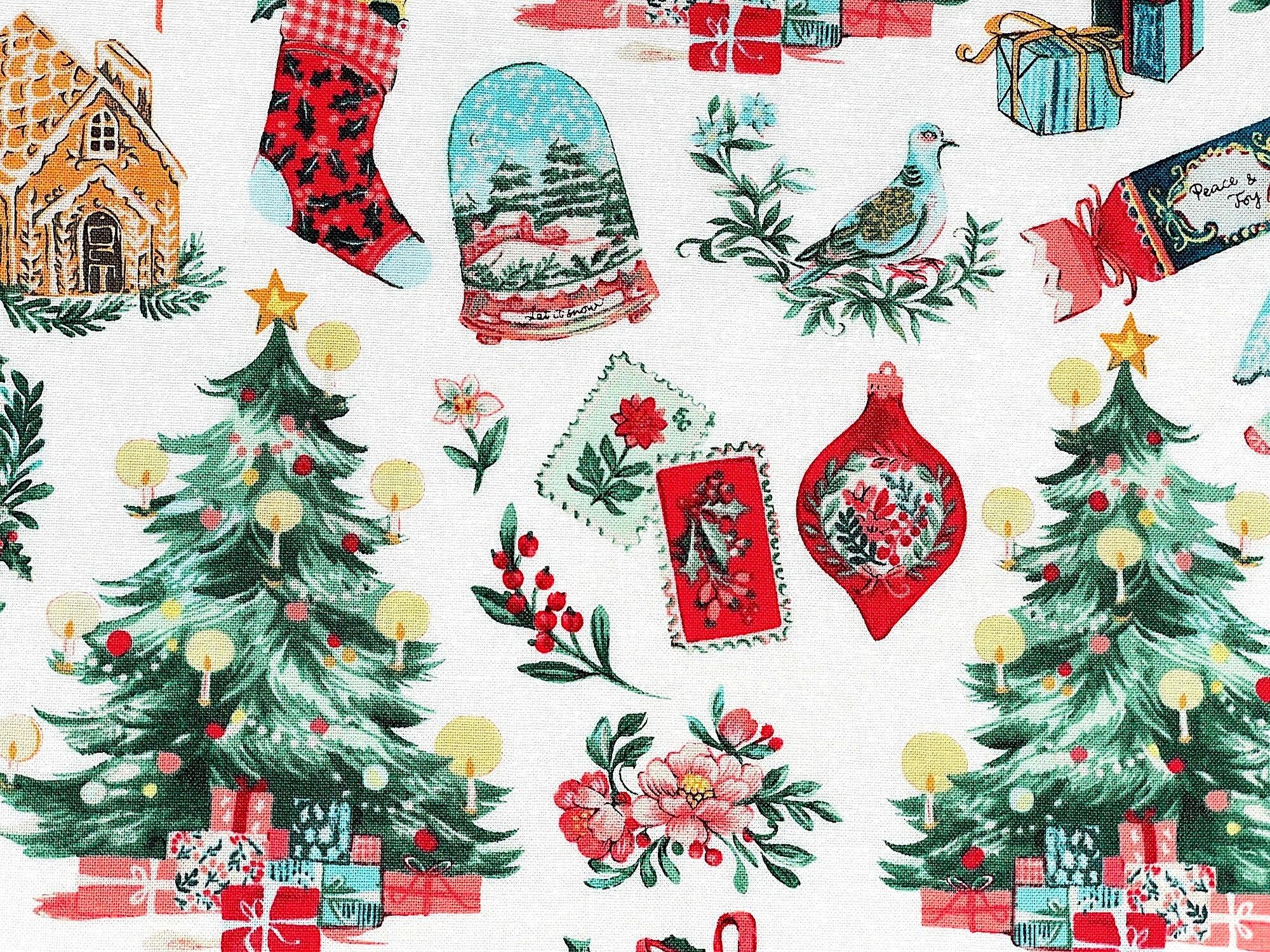 Close up of ornaments, flowers, birds, Christmas tree, stockings and more.